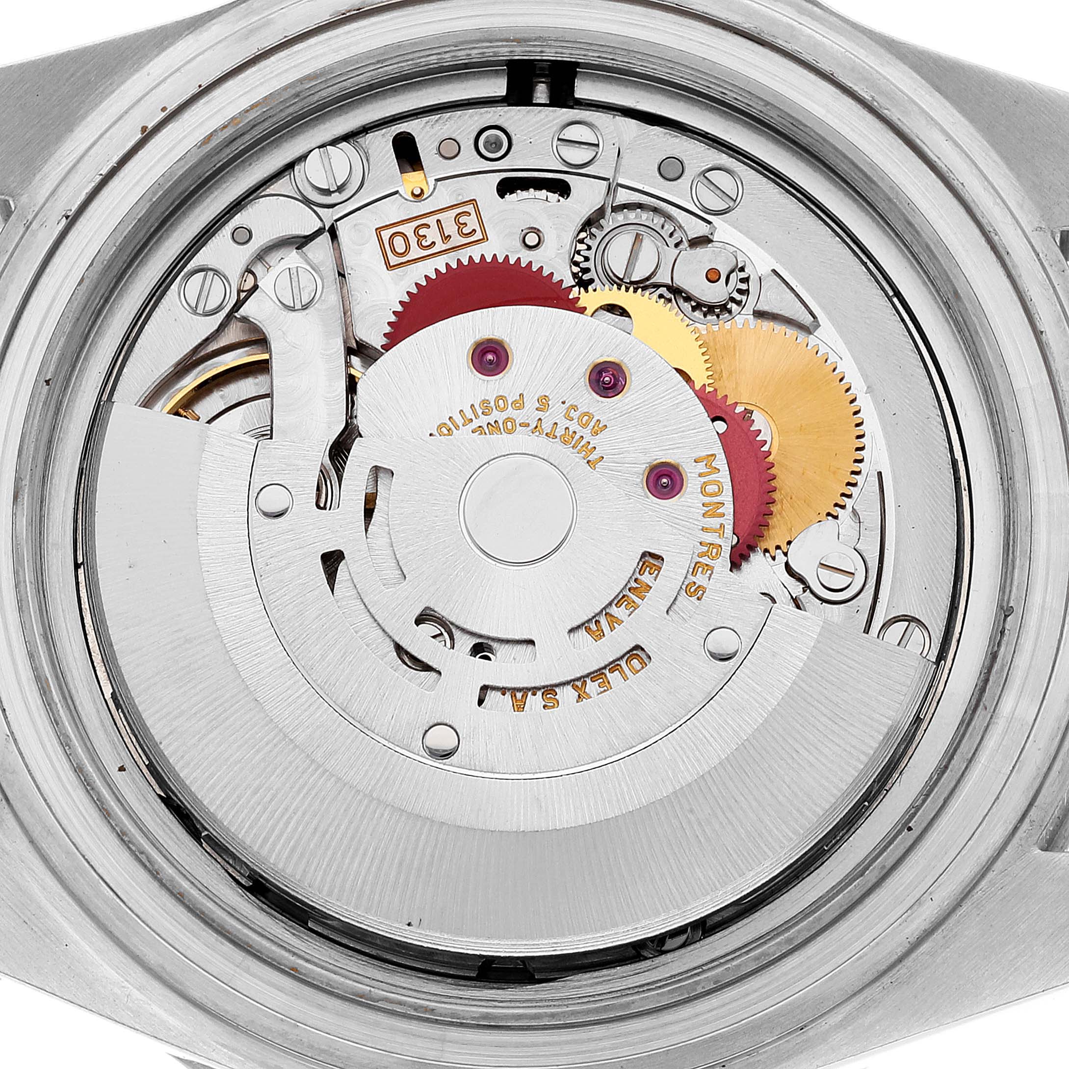 This image shows the movement mechanism of a Rolex Submariner 14060M Men's Stainless Steel Black Dial 14060M Men's Stainless Steel Black Dial watch from a rear angle.