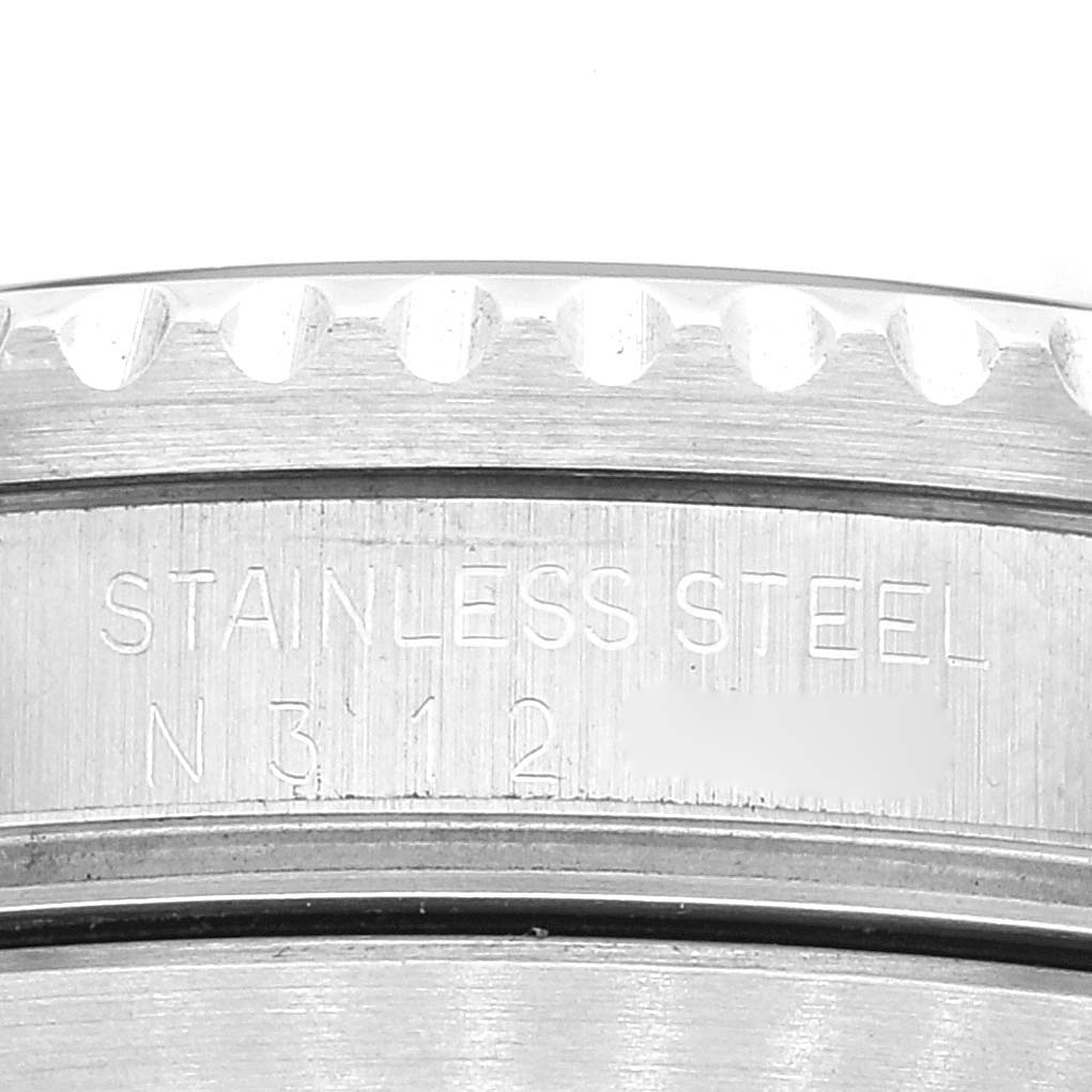 Close-up angle showing the engraving on the stainless steel caseback of a Rolex Submariner 16610 Men's Stainless Steel Black Dial 16610 Men's Stainless Steel Black Dial watch.