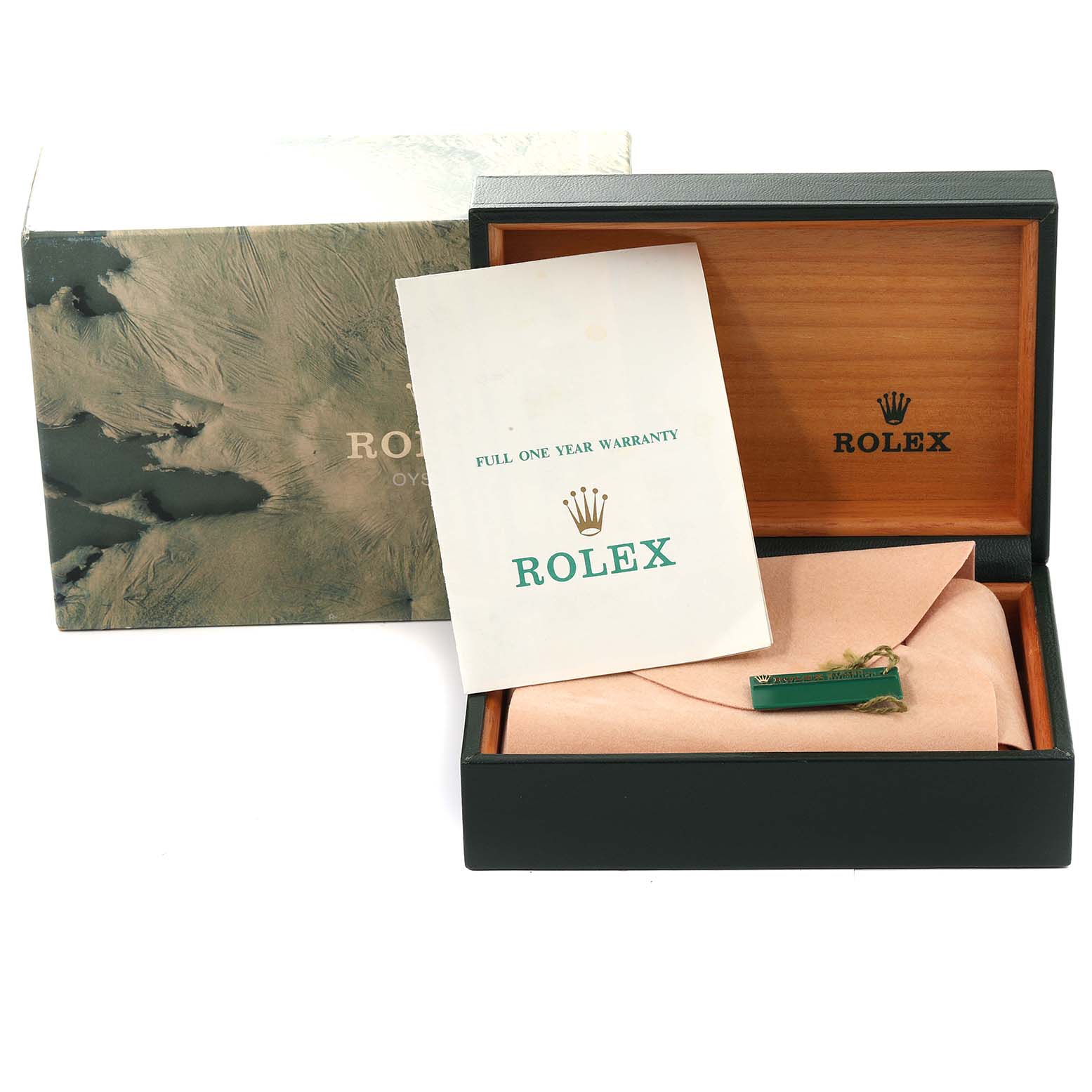The image shows the box, warranty card, and some accessories for the Rolex Submariner 14060 Men
s Stainless Steel Black Dial 14060 Men
s Stainless Steel Black Dial watch.