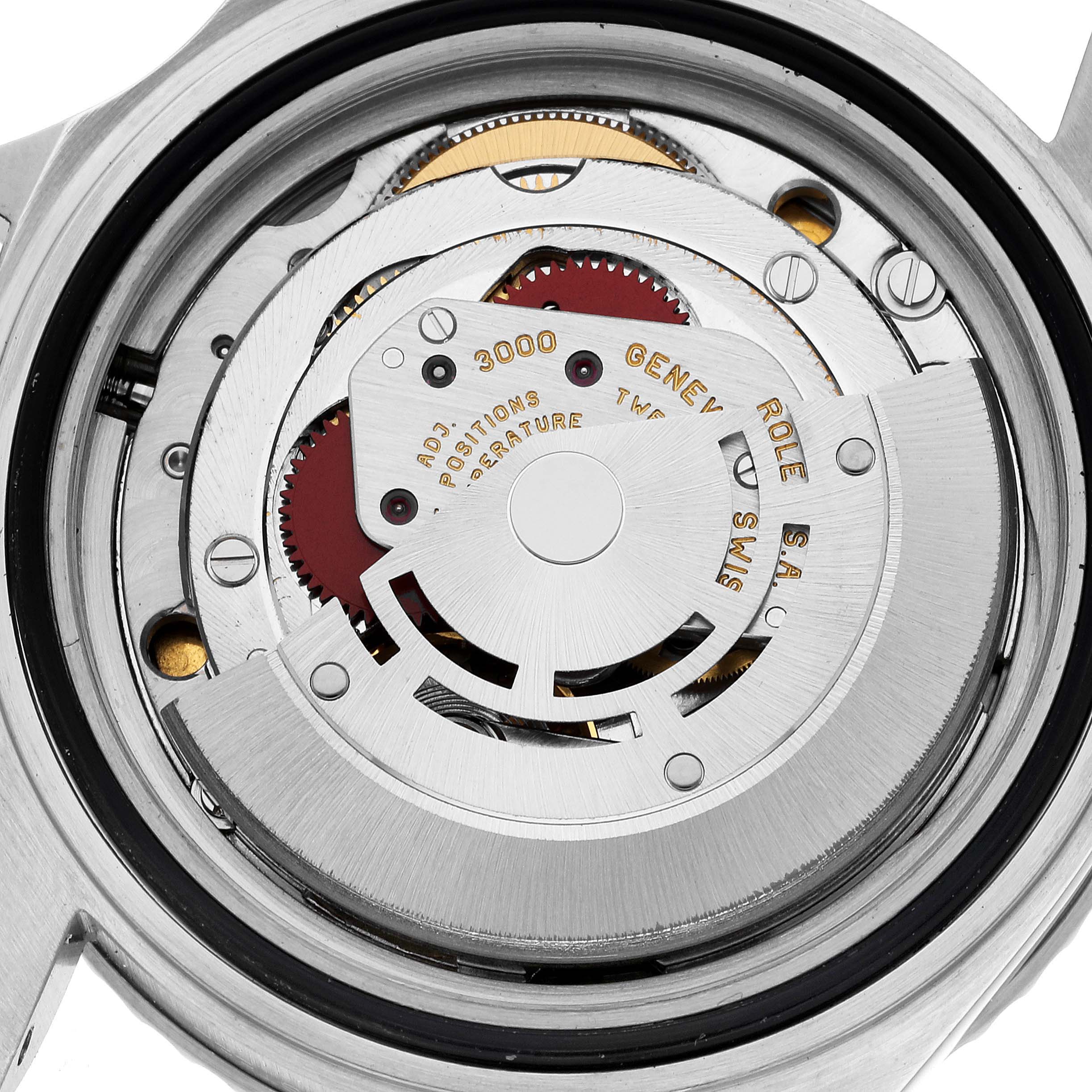 The image shows an inside view of the Rolex Submariner 14060 Men
s Stainless Steel Black Dial 14060 Men
s Stainless Steel Black Dial movement, highlighting its mechanical components.