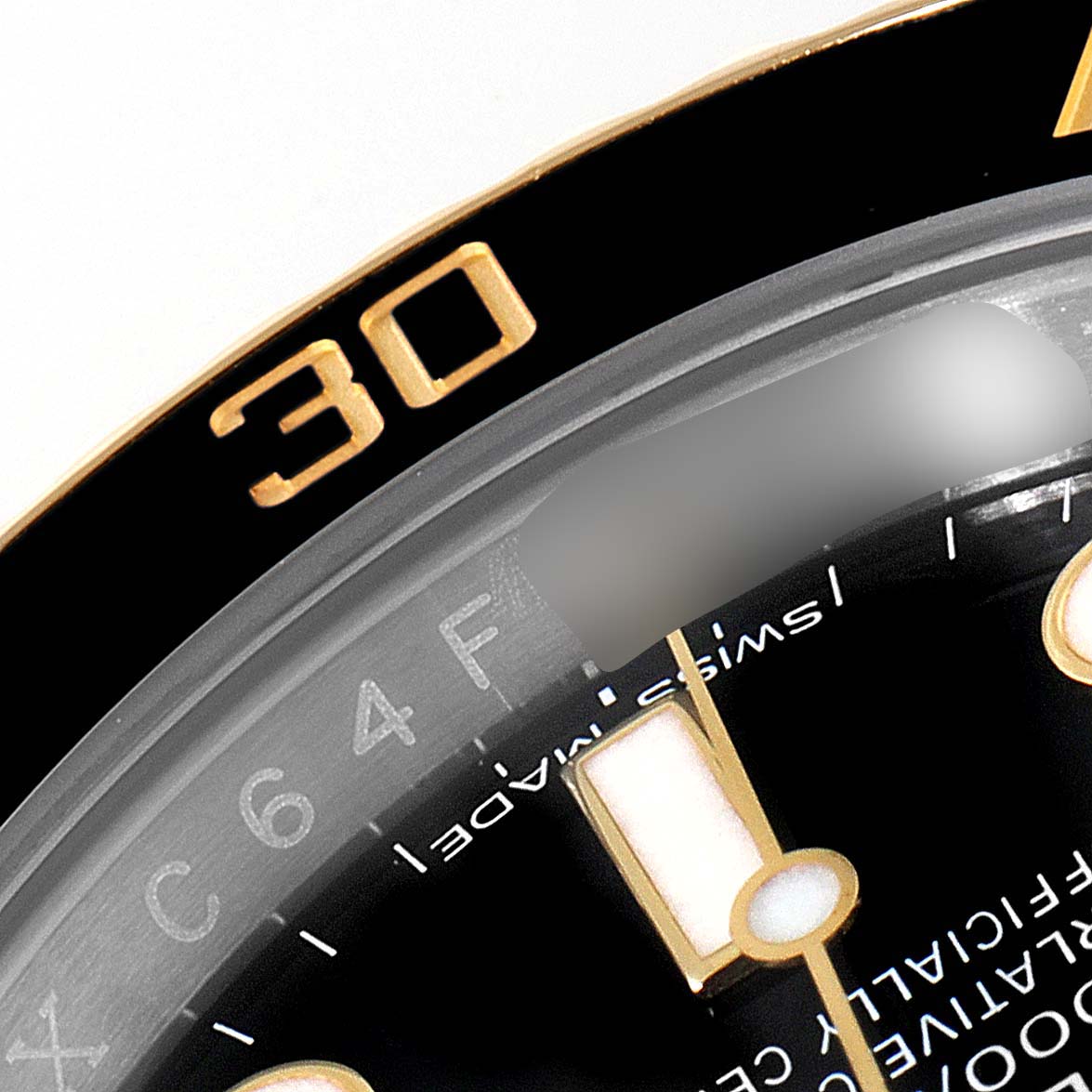 The image shows a close-up of the Rolex Submariner 116613 Men's Steel and Gold (two tone) Black Dial 116613 Men's Steel and Gold (two tone) Black Dial watch's bezel, dial, and part of the minute hand.