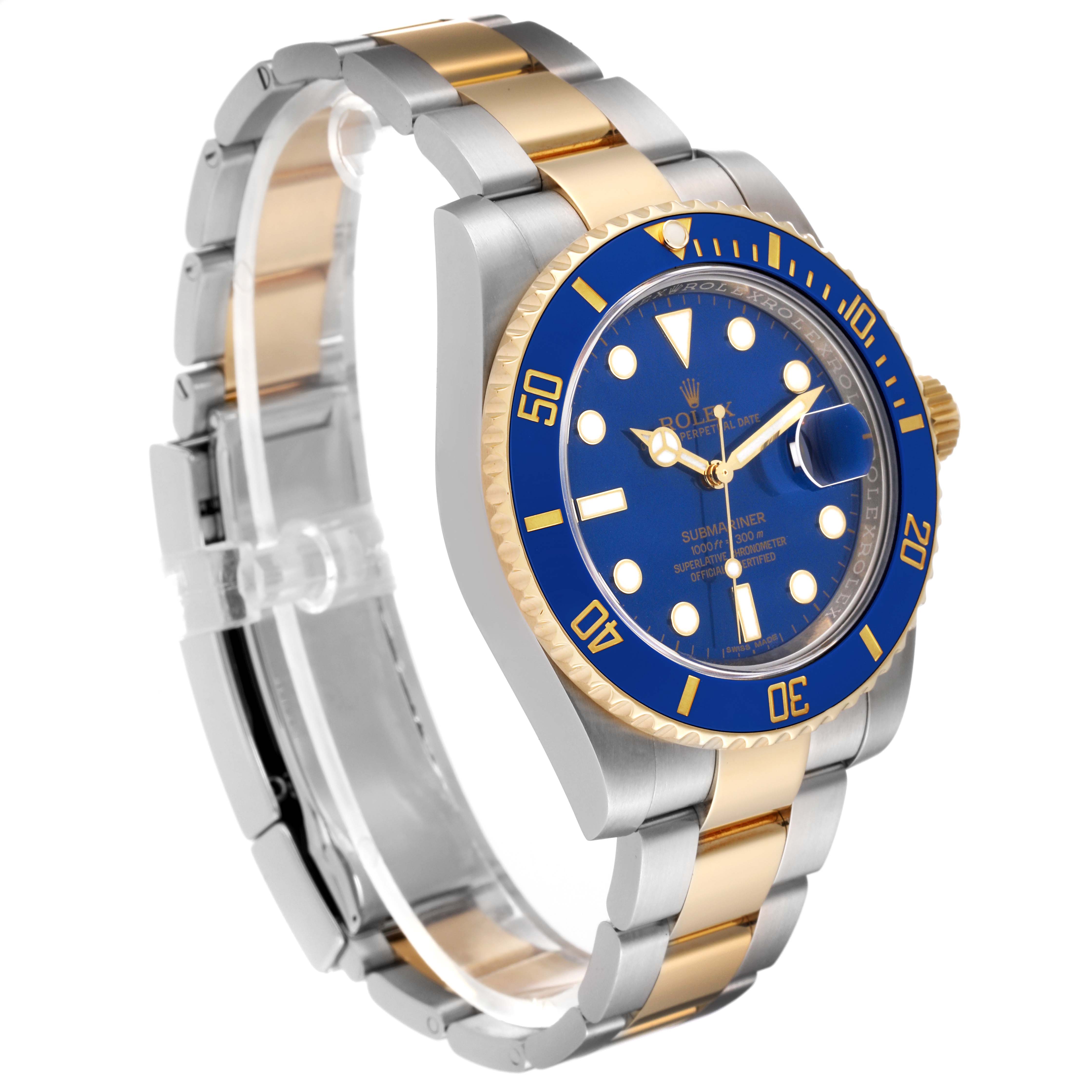 The image shows a Rolex Submariner 116613 Men
s Steel and Gold (two tone) Blue Dial 116613 Men
s Steel and Gold (two tone) Blue Dial watch at a slight angle, highlighting the band, bezel, and face with a blue dial and two-tone metal finish.