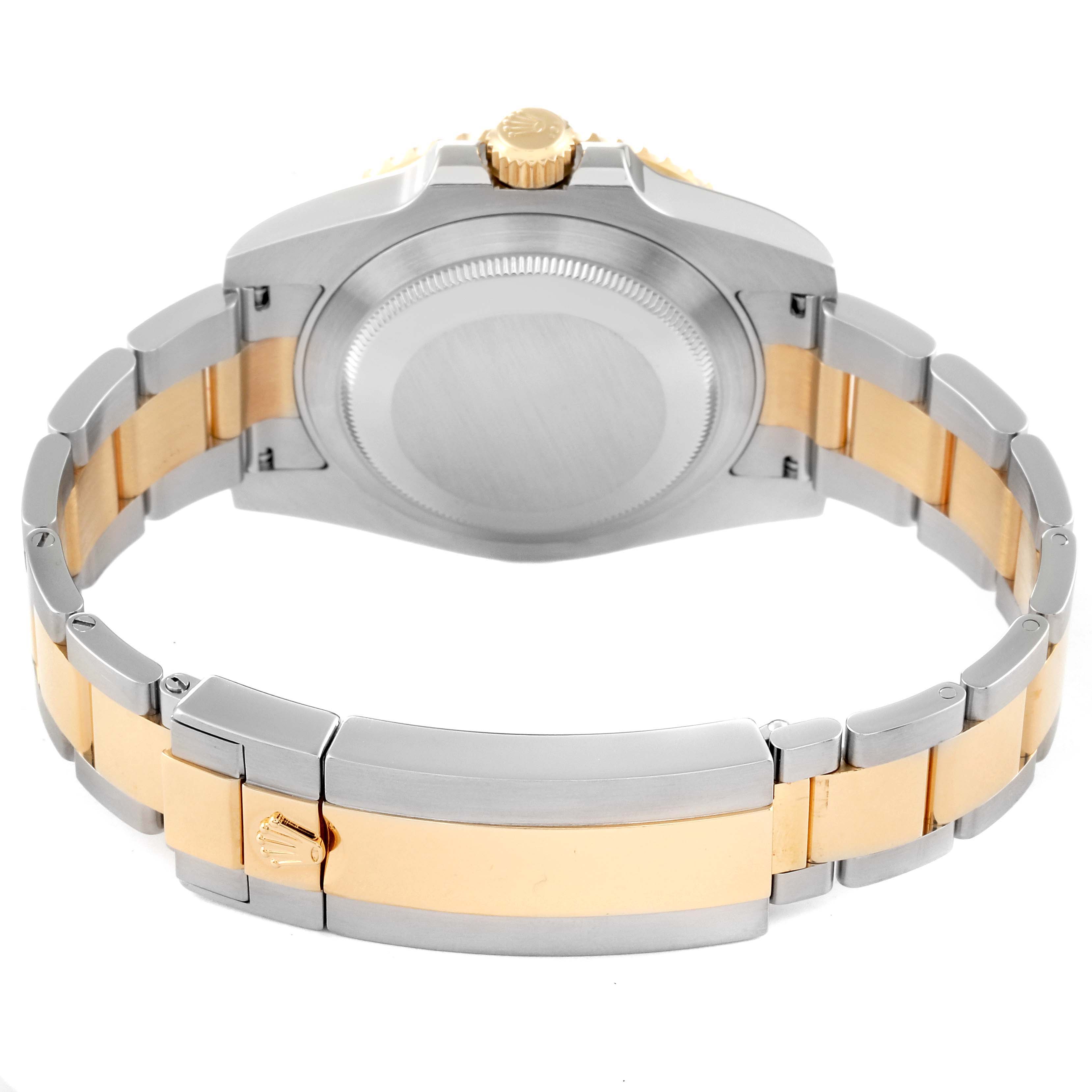 The image shows the back and bracelet of a Rolex Submariner 116613 Men
s Steel and Gold (two tone) Blue Dial 116613 Men
s Steel and Gold (two tone) Blue Dial, highlighting the clasp and case back in a two-tone metal finish.