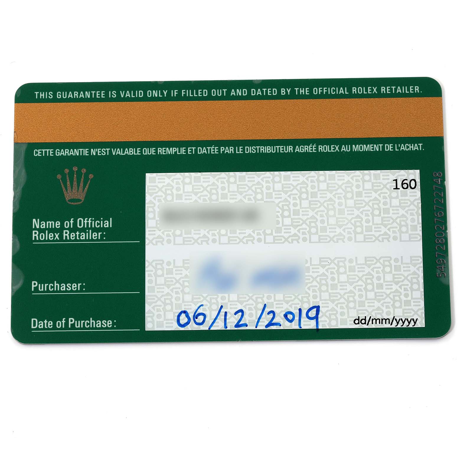 This is the warranty card for a Rolex Submariner 116613 Men
s Steel and Gold (two tone) Blue Dial 116613 Men
s Steel and Gold (two tone) Blue Dial, shown from a top-down angle.