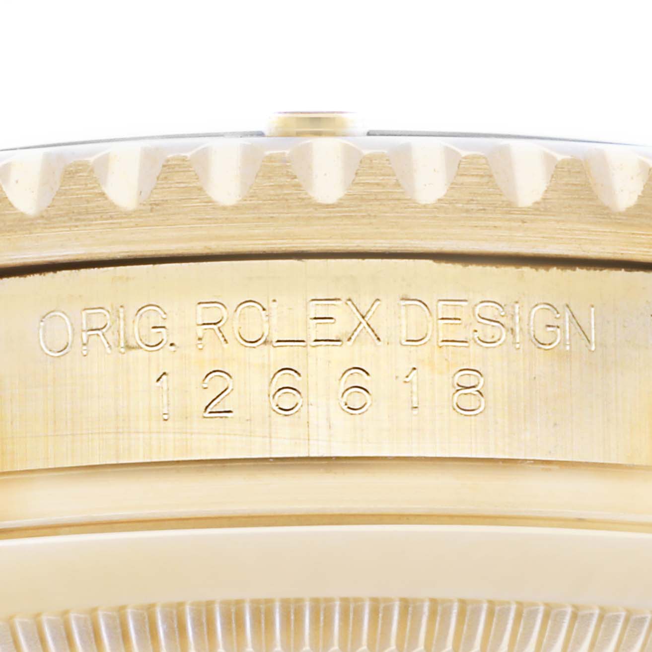 This close-up image of the Rolex Submariner 126618 Men's Yellow Gold Black Dial 126618 Men's Yellow Gold Black Dial watch displays the side view, focusing on the engraved model number "126618".