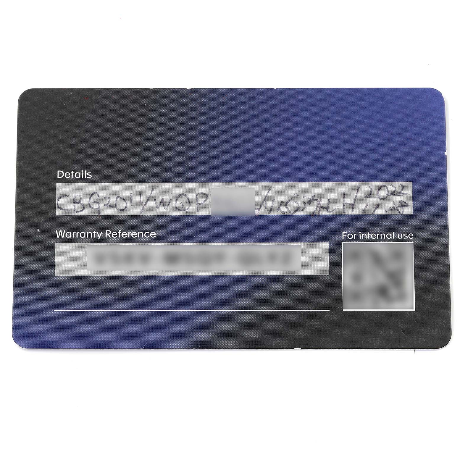 The image shows a close-up of the warranty card for the Tag Heuer Carrera CBG2011 Men's Stainless Steel Blue Dial CBG2011 Men's Stainless Steel Blue Dial model watch.