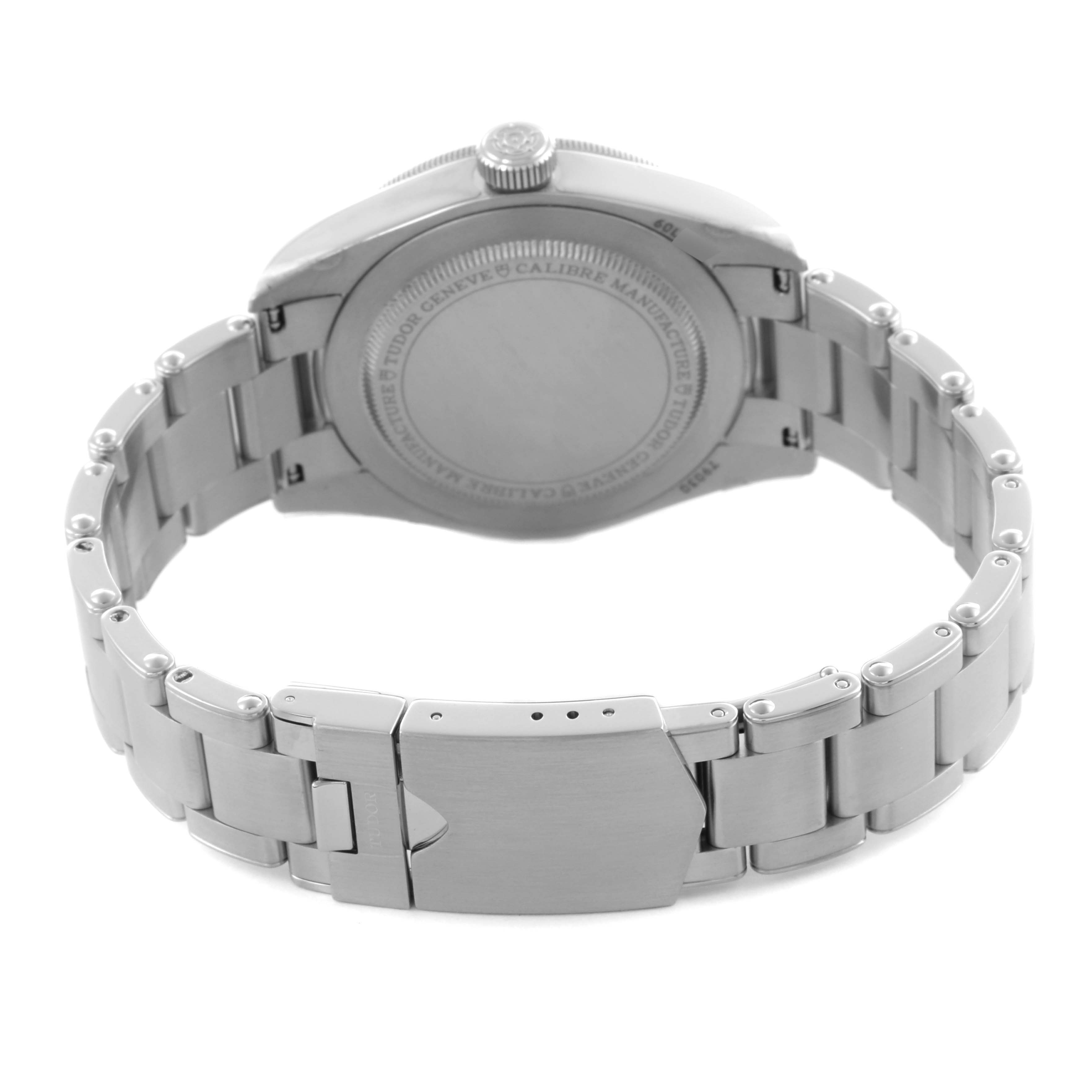 The image shows the back view of a Tudor Heritage Black Bay M79030B-0001 Men's Stainless Steel Blue Dial M79030B-0001 Men's Stainless Steel Blue Dial watch, focusing on the case back and metal bracelet clasp.