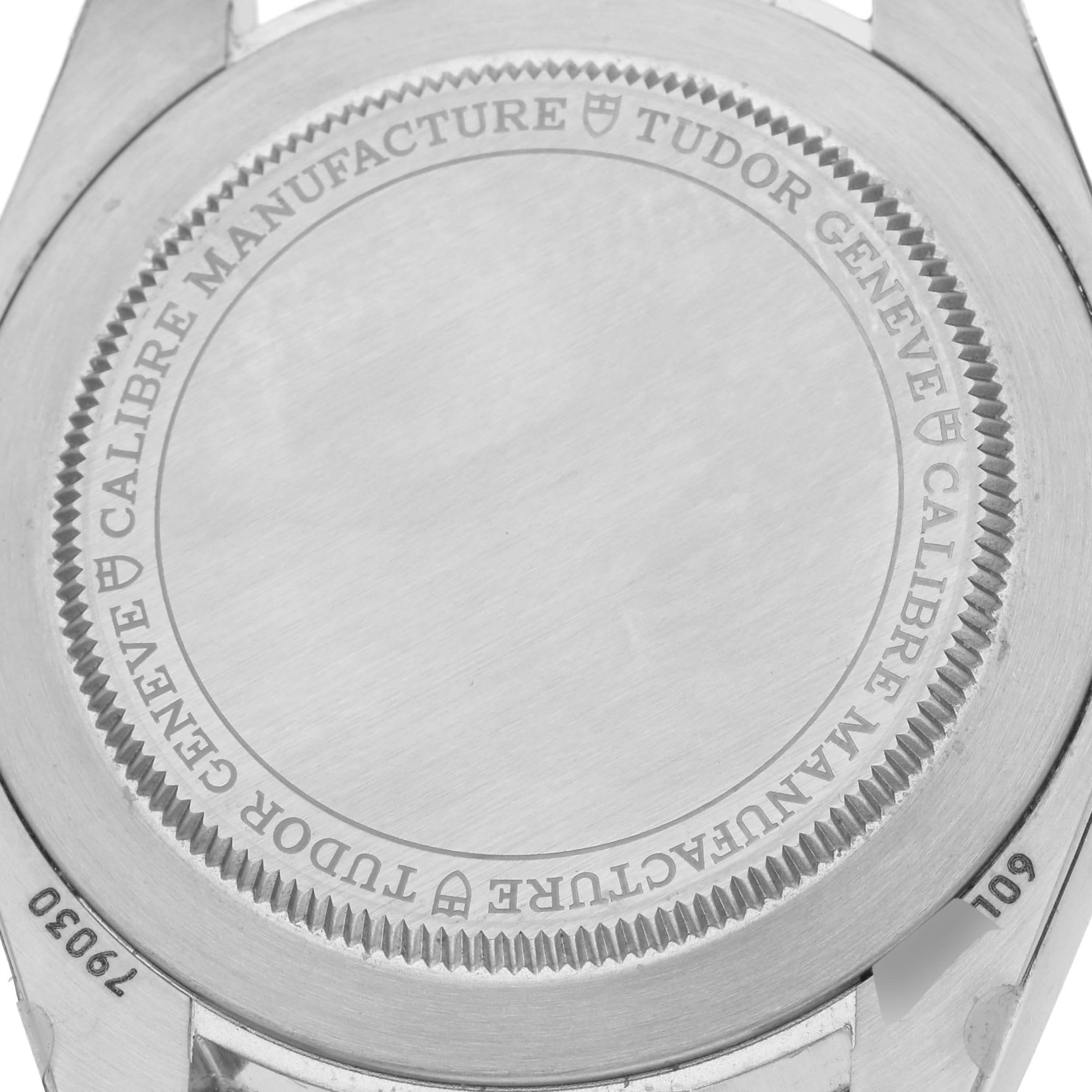 The image shows the back case of a Tudor Heritage Black Bay M79030B-0001 Men's Stainless Steel Blue Dial M79030B-0001 Men's Stainless Steel Blue Dial watch, featuring engraved branding and specifications.