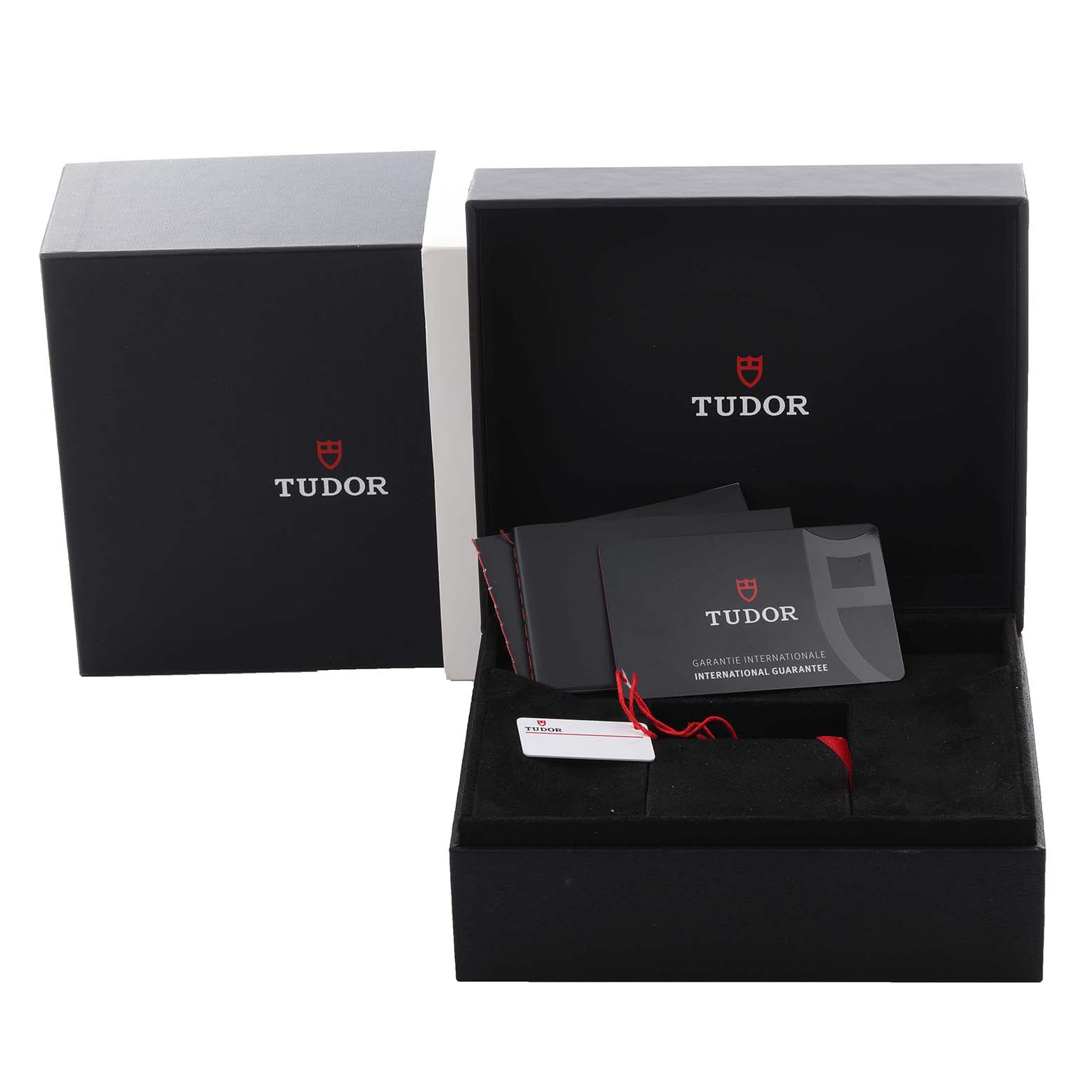 The image shows the Tudor Heritage Black Bay M79030B-0001 Men's Stainless Steel Blue Dial M79030B-0001 Men's Stainless Steel Blue Dial watch packaging, including the box, guarantee cards, and tags.