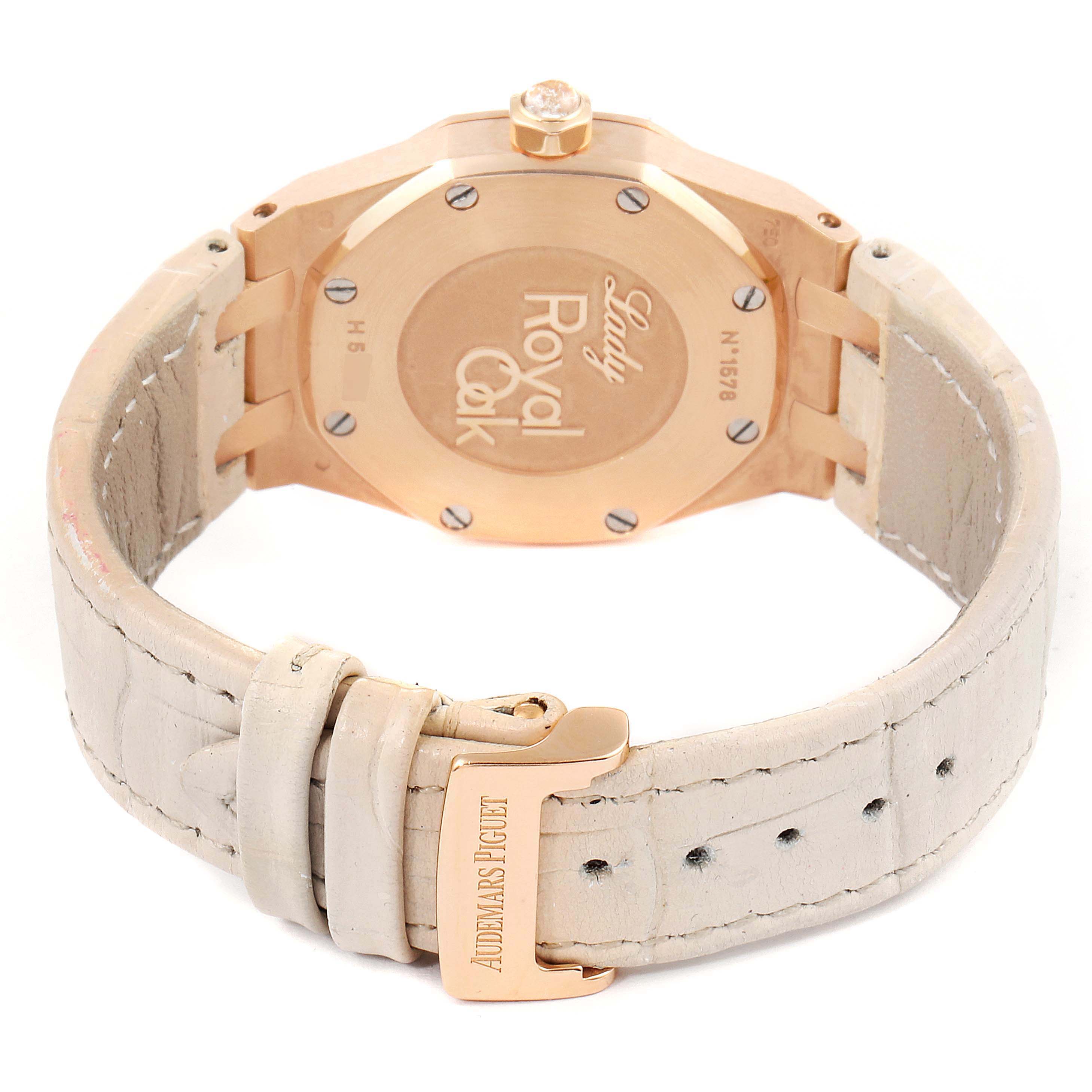 This image shows the case back and clasp of the Royal Oak by Audemars Piguet, highlighting its leather strap and engraved logo.