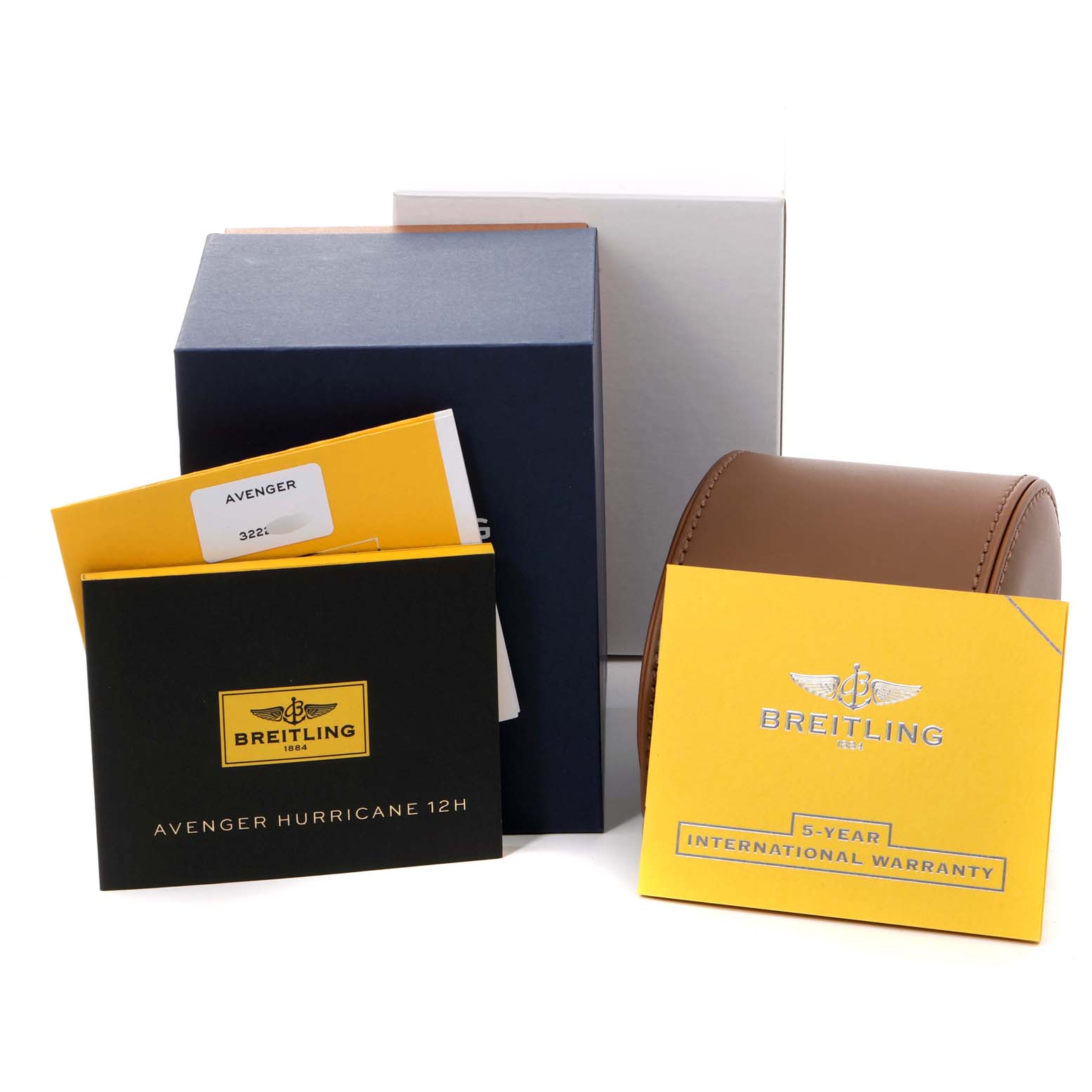 The image shows boxes and documents for a Breitling Avenger XB0180E4/BF31 Men's Titanium Black Dial XB0180E4/BF31 Men's Titanium Black Dial watch, including a manual, warranty card, and a leather case.