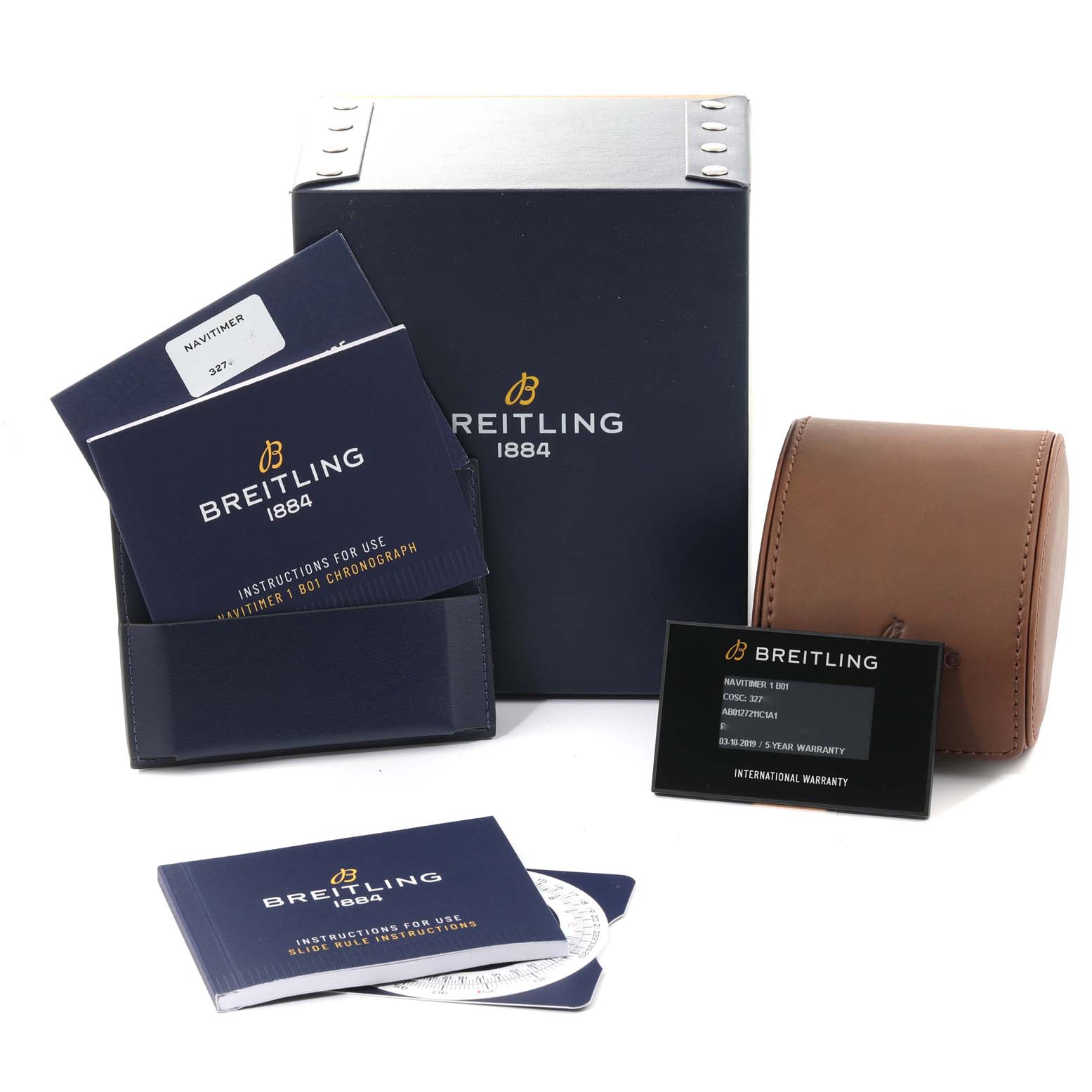 The image shows a Breitling Navitimer AB0127 Men's Stainless Steel Blue Dial AB0127 Men's Stainless Steel Blue Dial watch's packaging, instruction manuals, warranty card, and a brown leather watch case, shot from the front angle.