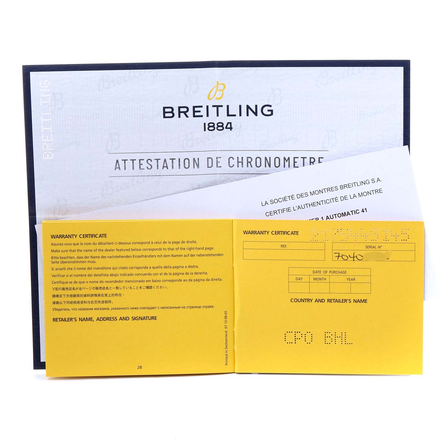 The image shows the warranty certificate and chronometer attestation for a Breitling Navitimer U17326 Men's Steel and Gold (two tone) Grey Dial U17326 Men's Steel and Gold (two tone) Grey Dial watch, including documents and serial information.