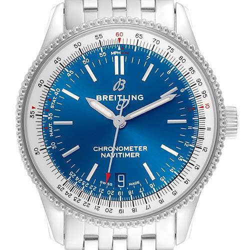 The Breitling Navitimer watch is shown from a top-down angle, highlighting its blue dial, bezel, and part of the metal bracelet.