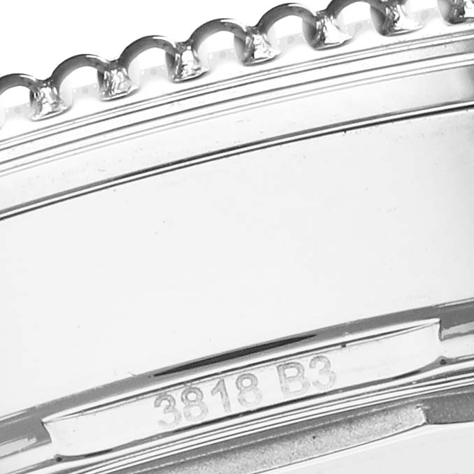 The image shows a close-up of the bezel edge and engraved serial number on the Breitling Navitimer A17325211C1A1 Men's Stainless Steel Blue Dial A17325211C1A1 Men's Stainless Steel Blue Dial watch.