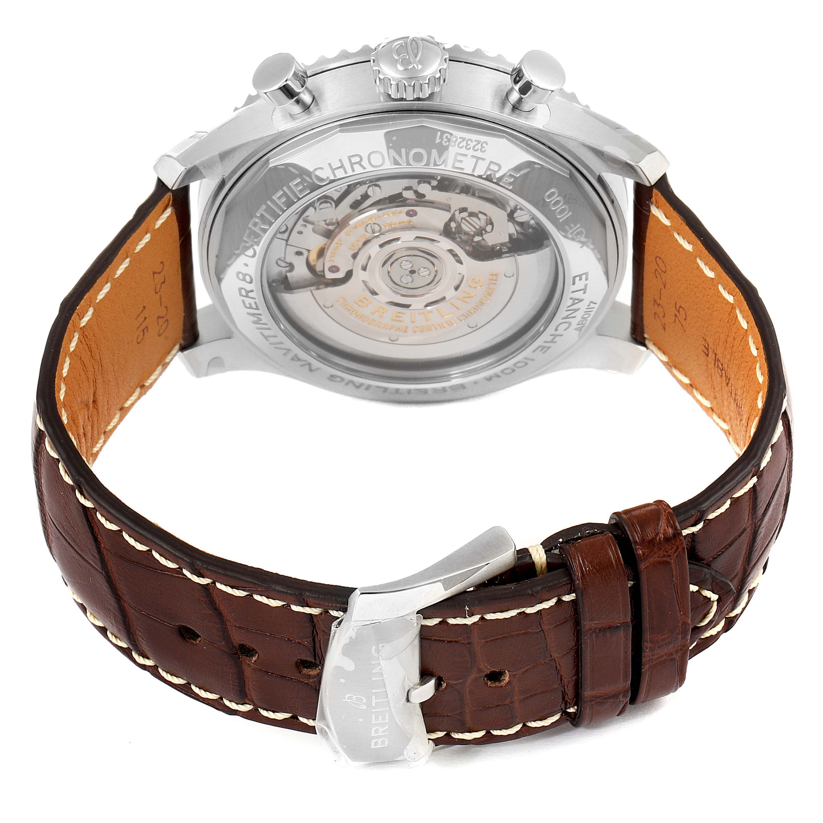 The image shows the back view of a Breitling Navitimer watch, highlighting its transparent case back and leather strap details.