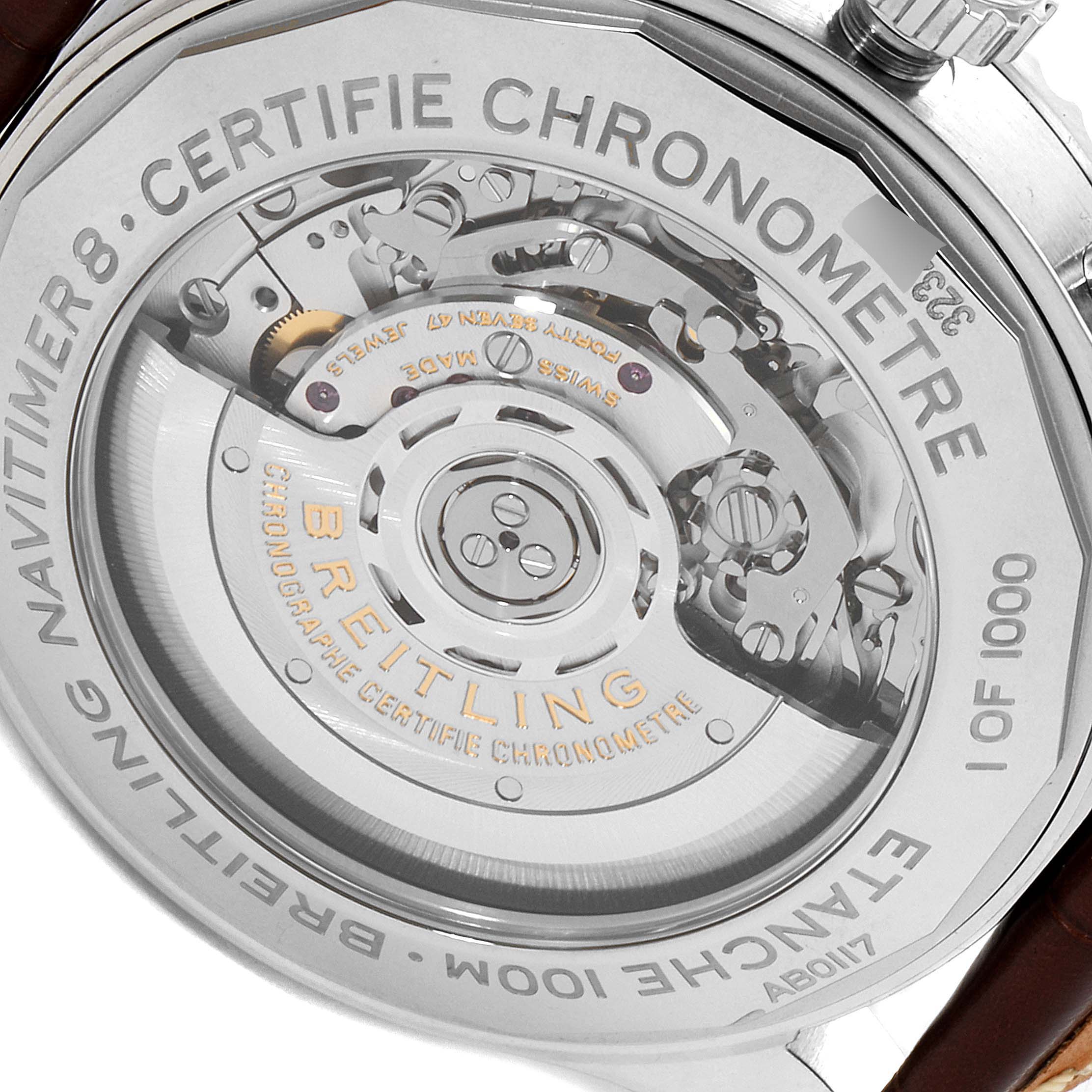The image shows the backside of the Breitling Navitimer watch, highlighting the intricate movement and engravings on the case back.