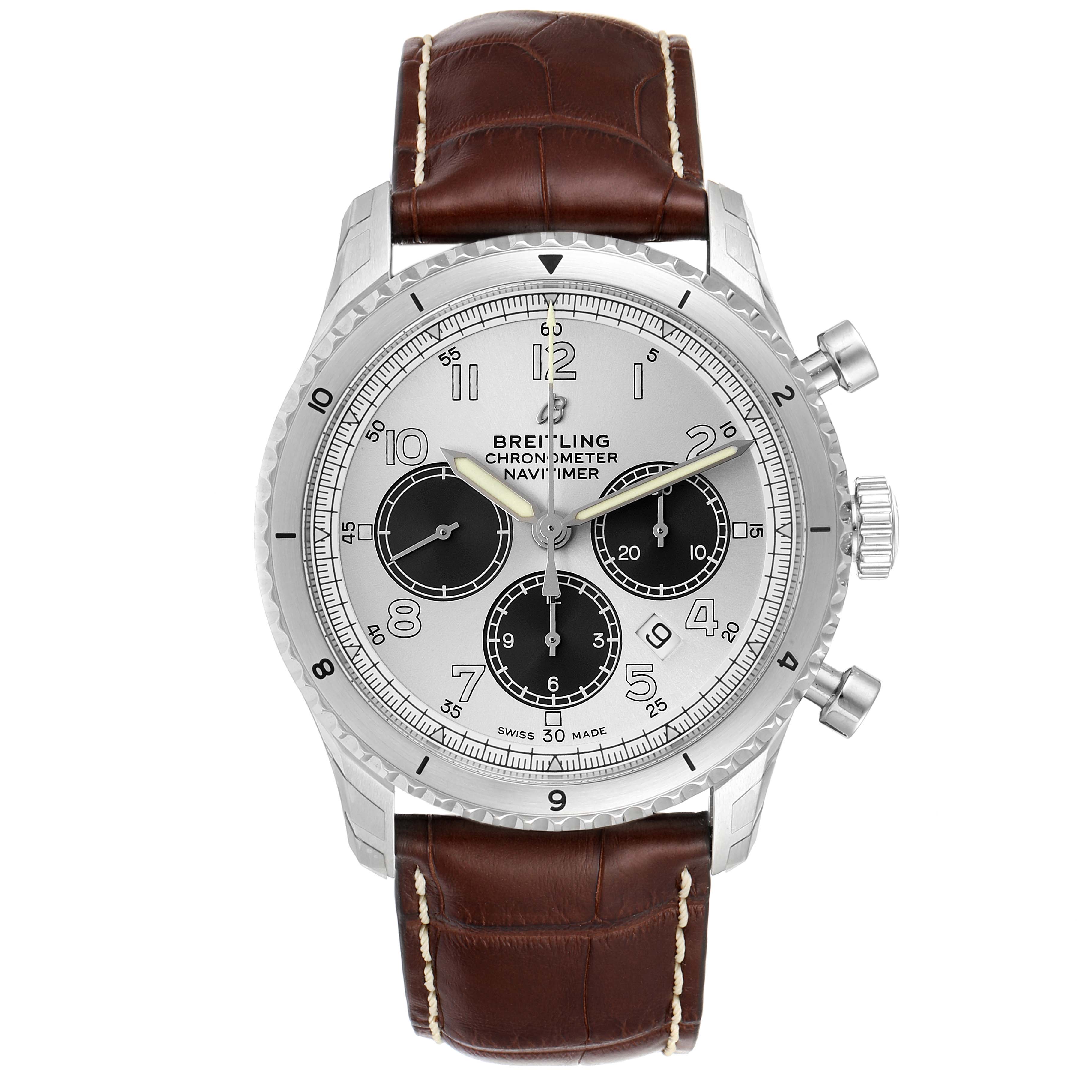 The image shows a face-on view of a Breitling Navitimer watch with a brown leather strap and silver dial.