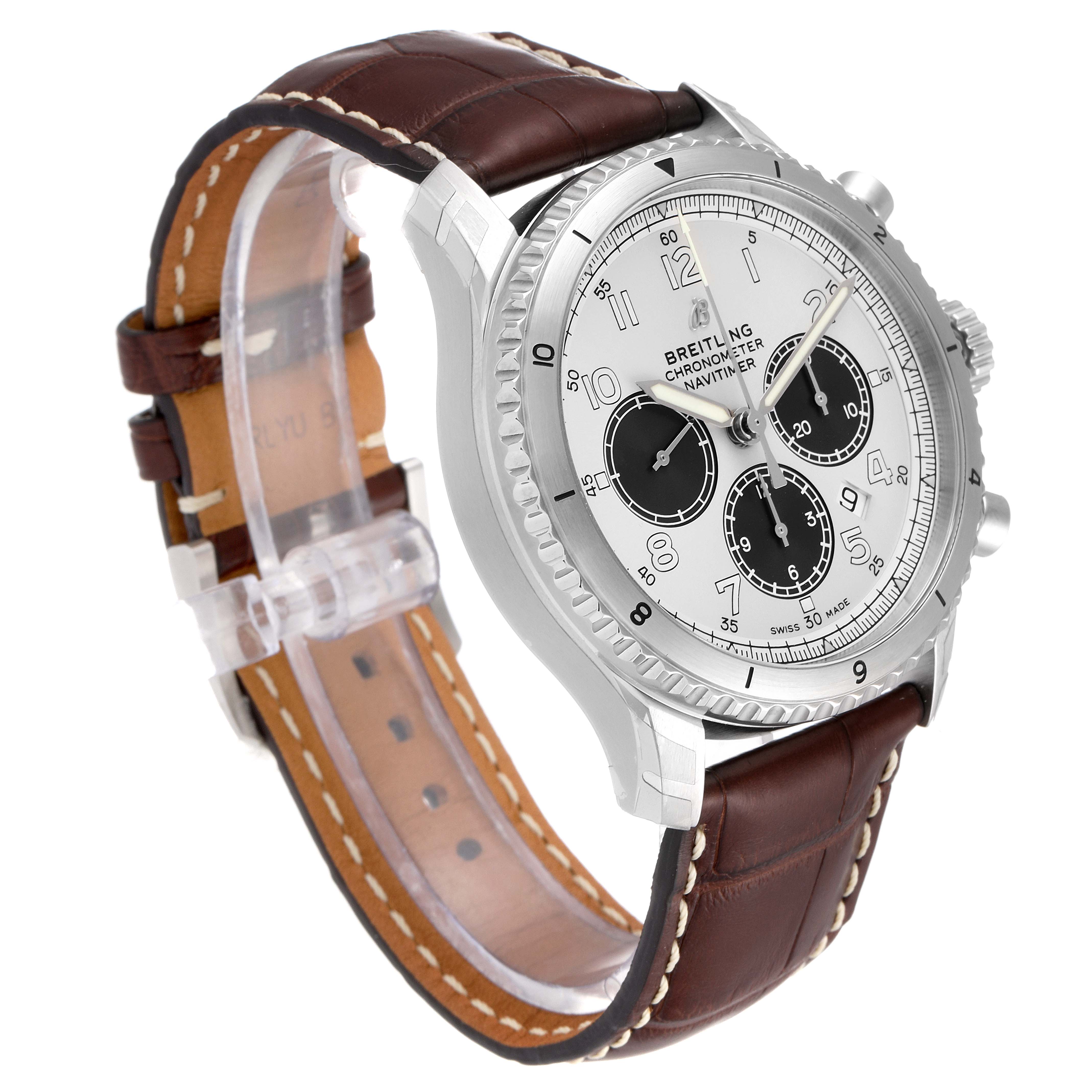The image shows a side angle of a Breitling Navitimer watch, highlighting its face, bezel, leather strap, and crown.