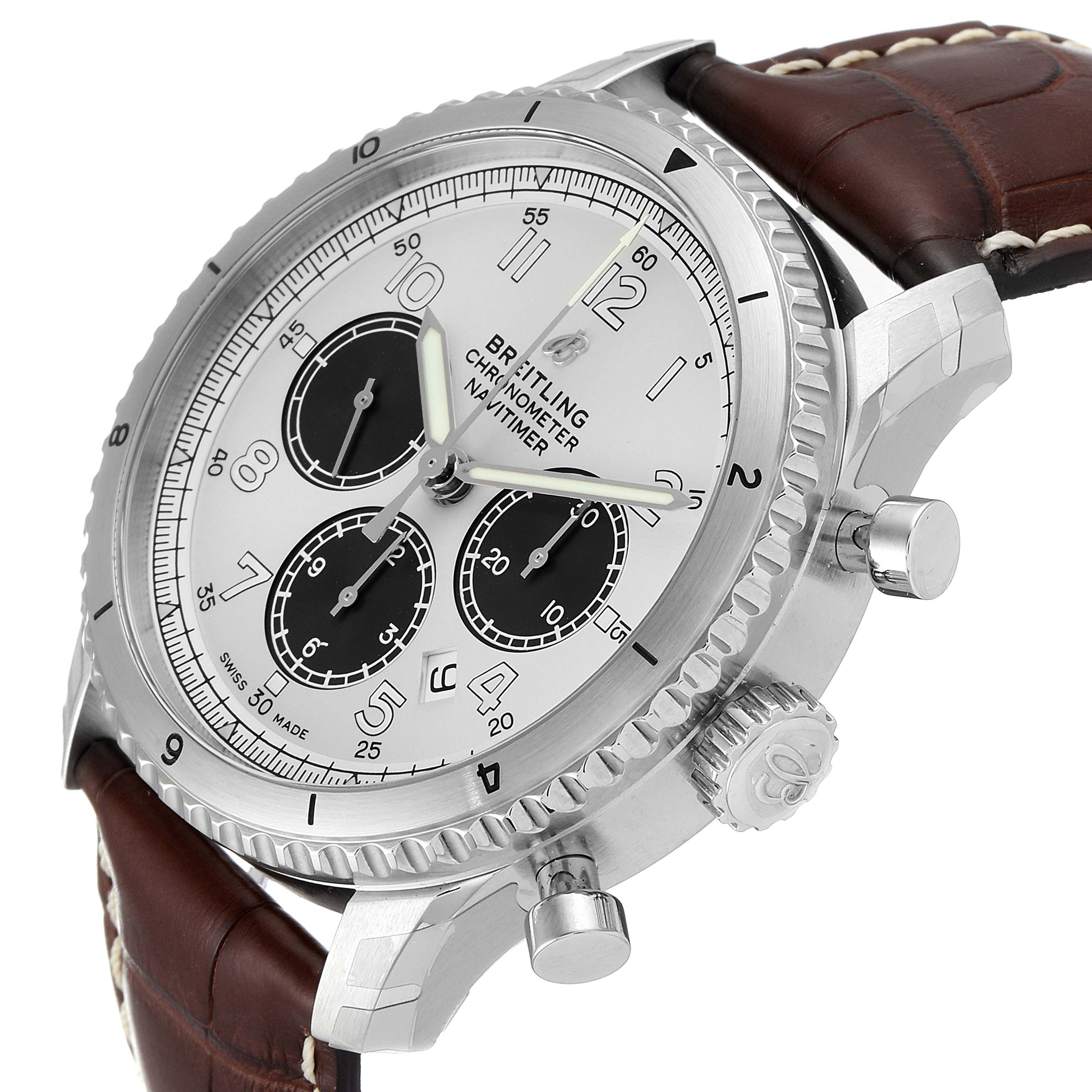 The image shows a side angle of a Breitling Navitimer watch, highlighting its chronograph dials, bezel, crown, and brown leather strap.