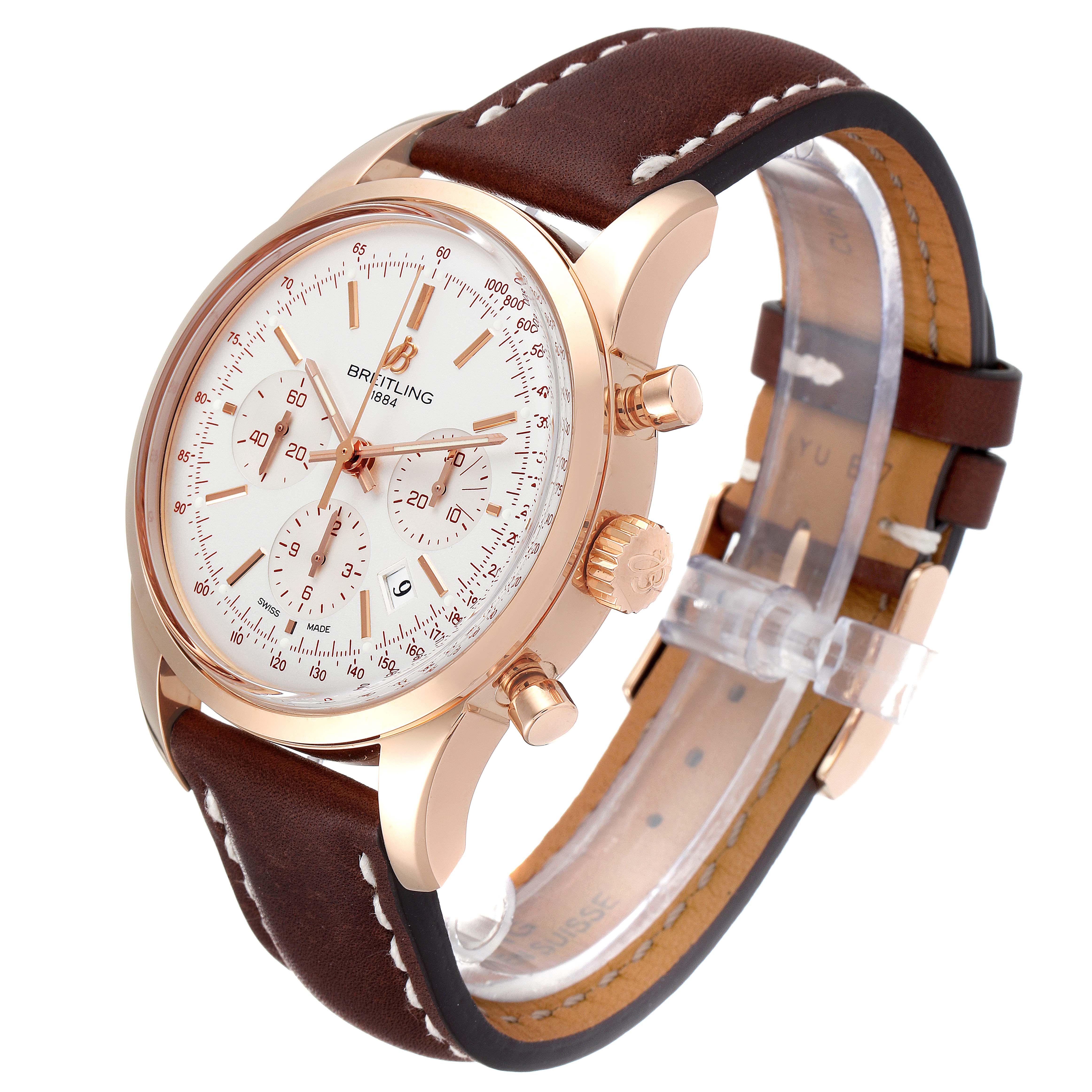 The image shows a Breitling Transocean RB0152 Men's Rose Gold Silver Dial RB0152 Men's Rose Gold Silver Dial watch at a three-quarter angle, highlighting its dial, crown, chronograph pushers, and leather strap.