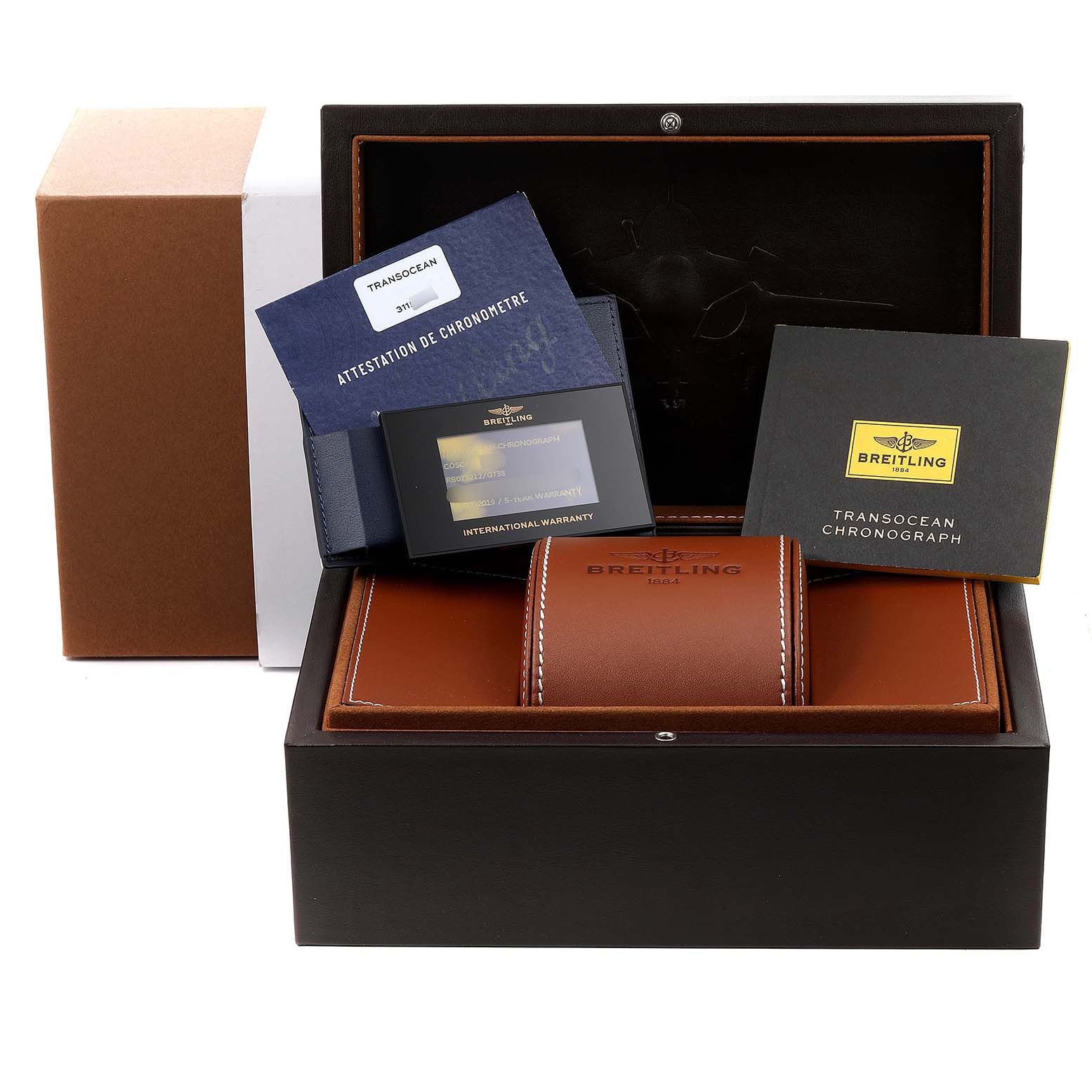 The image shows a Breitling Transocean RB0152 Men's Rose Gold Silver Dial RB0152 Men's Rose Gold Silver Dial watch box with accompanying documents, warranty cards, and a cushioned watch holder.