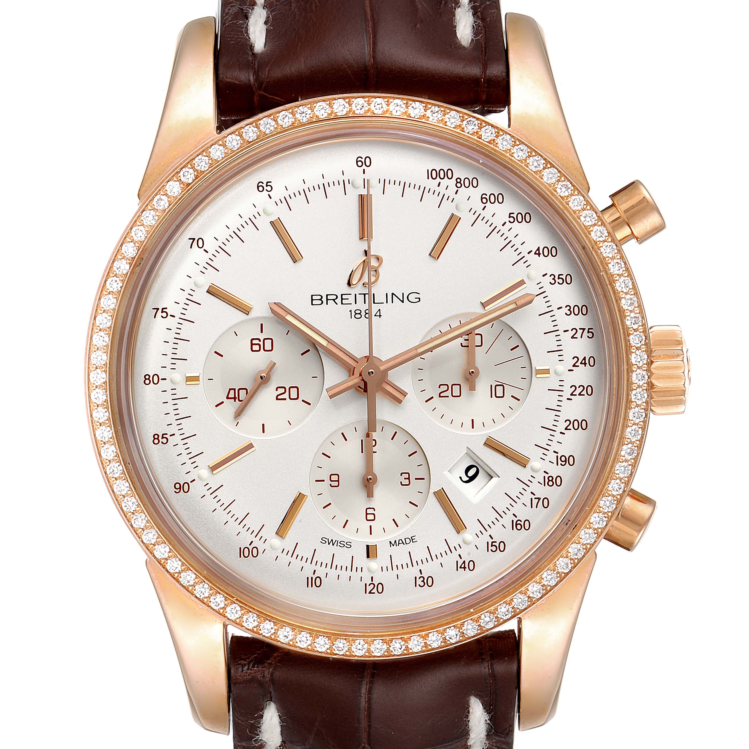 This image shows a front view of a Breitling Transocean RB0152 Men's Rose Gold Silver Dial RB0152 Men's Rose Gold Silver Dial watch featuring a brown leather strap, gold case, diamond bezel, multiple sub-dials, and a date window.