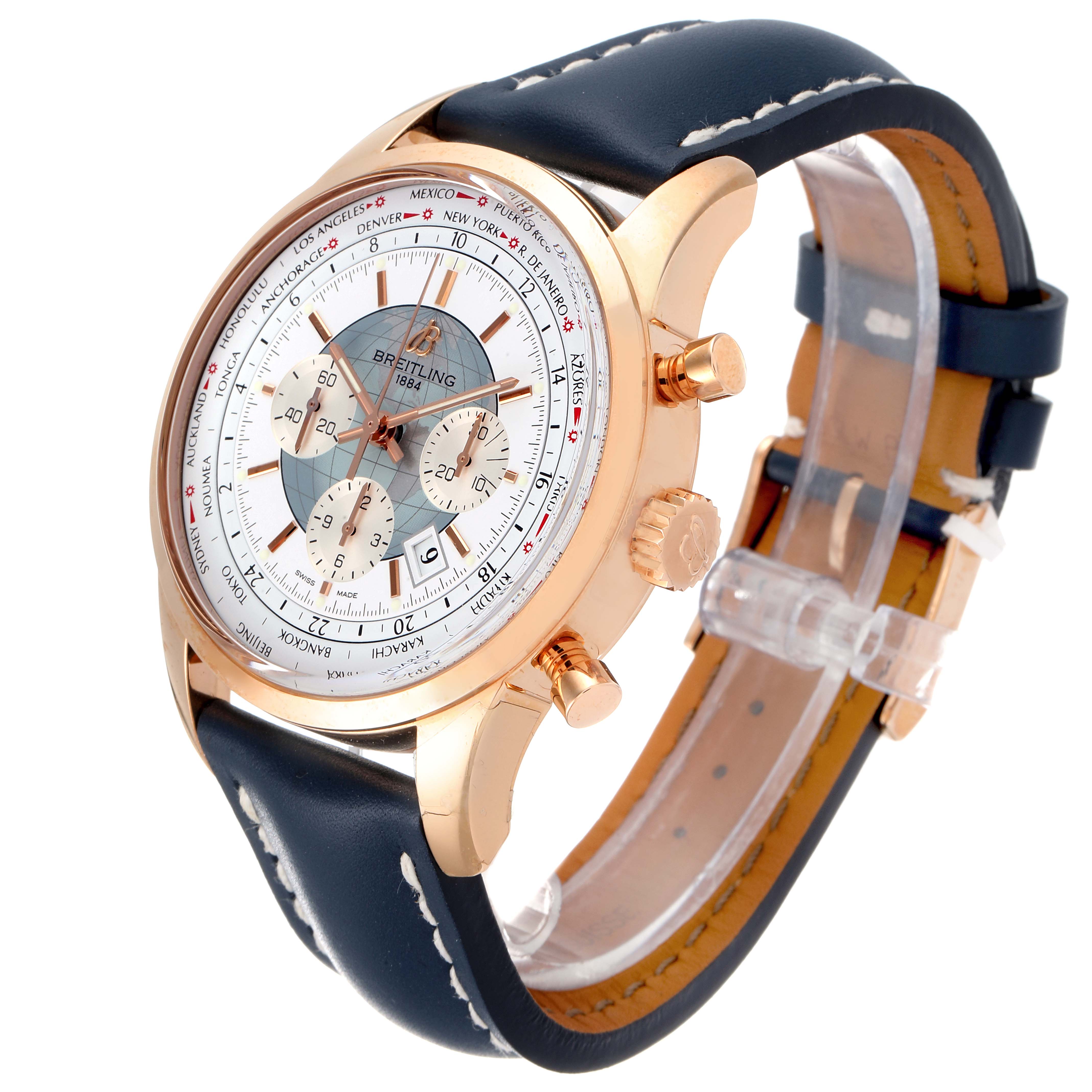 The Breitling Transocean RB0510U4-BB63BKLD Men's Rose Gold White Dial RB0510U4-BB63BKLD Men's Rose Gold White Dial watch is shown from a three-quarter view, displaying the face, crown, pushers, and leather strap.