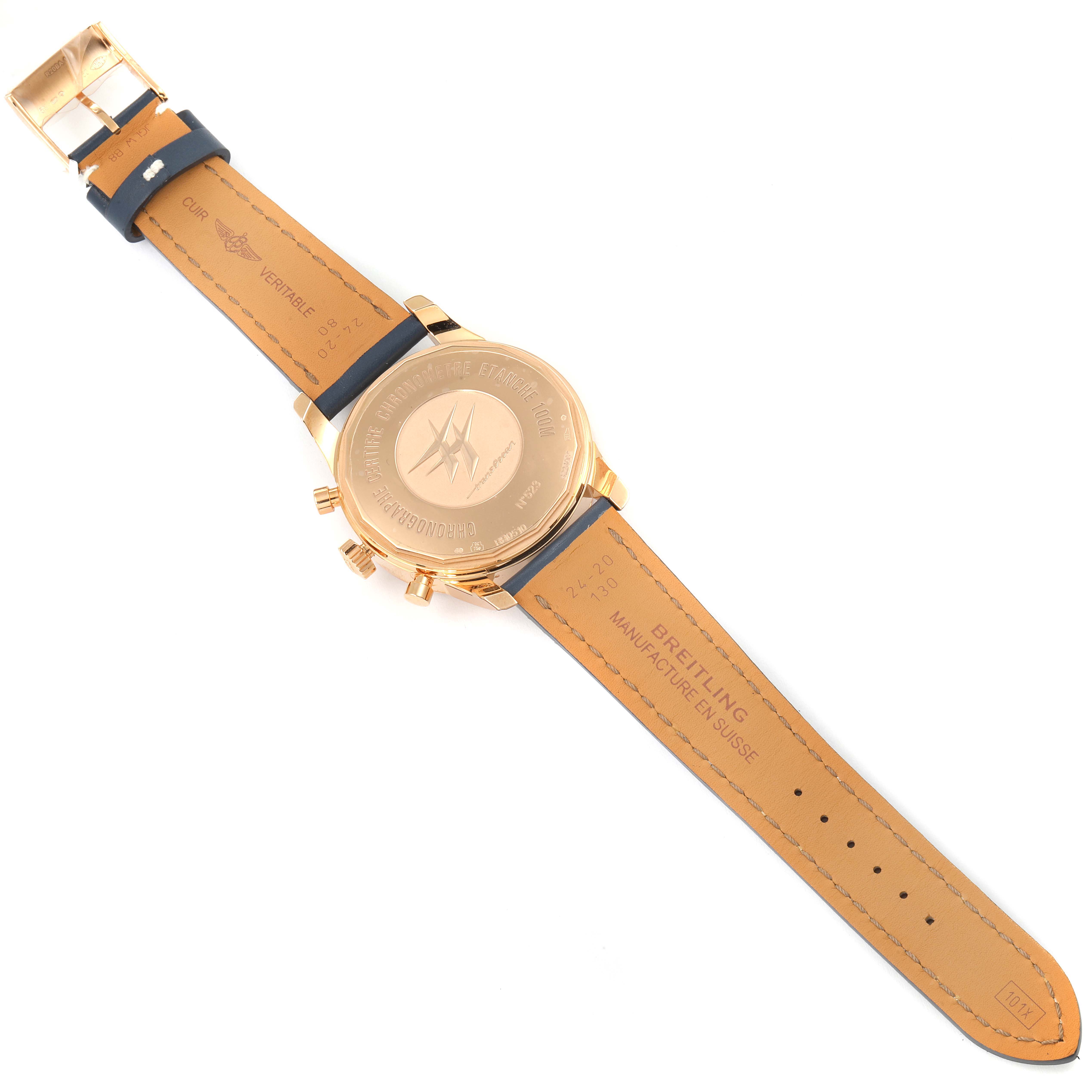 The image shows the backside of the Breitling Transocean RB0510U4-BB63BKLD Men's Rose Gold White Dial RB0510U4-BB63BKLD Men's Rose Gold White Dial watch laying flat, displaying the case back, straps, and buckle.