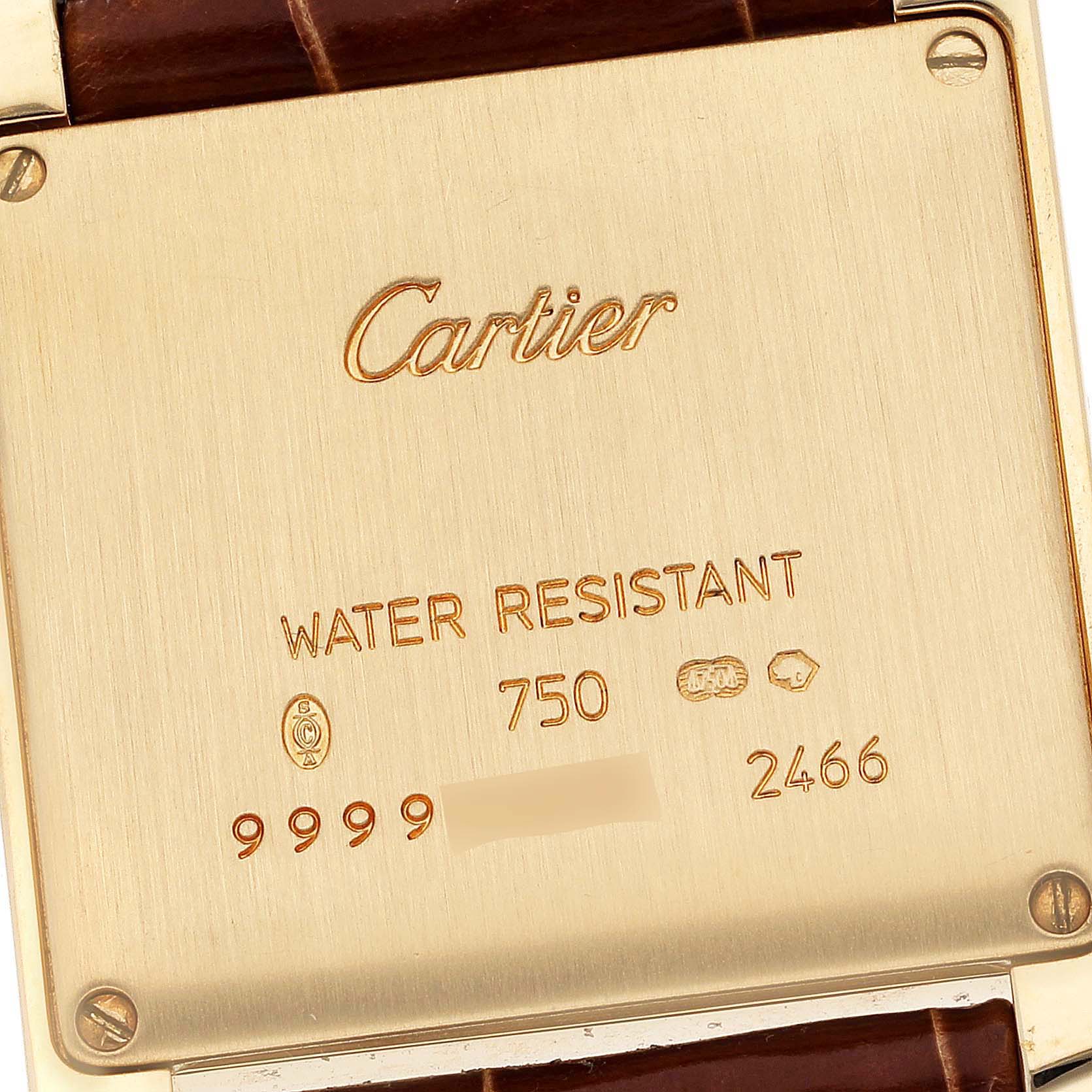 The image shows the back plate of a Cartier Tank Francaise W5001456 Women's Yellow Gold Silver Dial W5001456 Women's Yellow Gold Silver Dial watch, displaying the brand name and specifications.