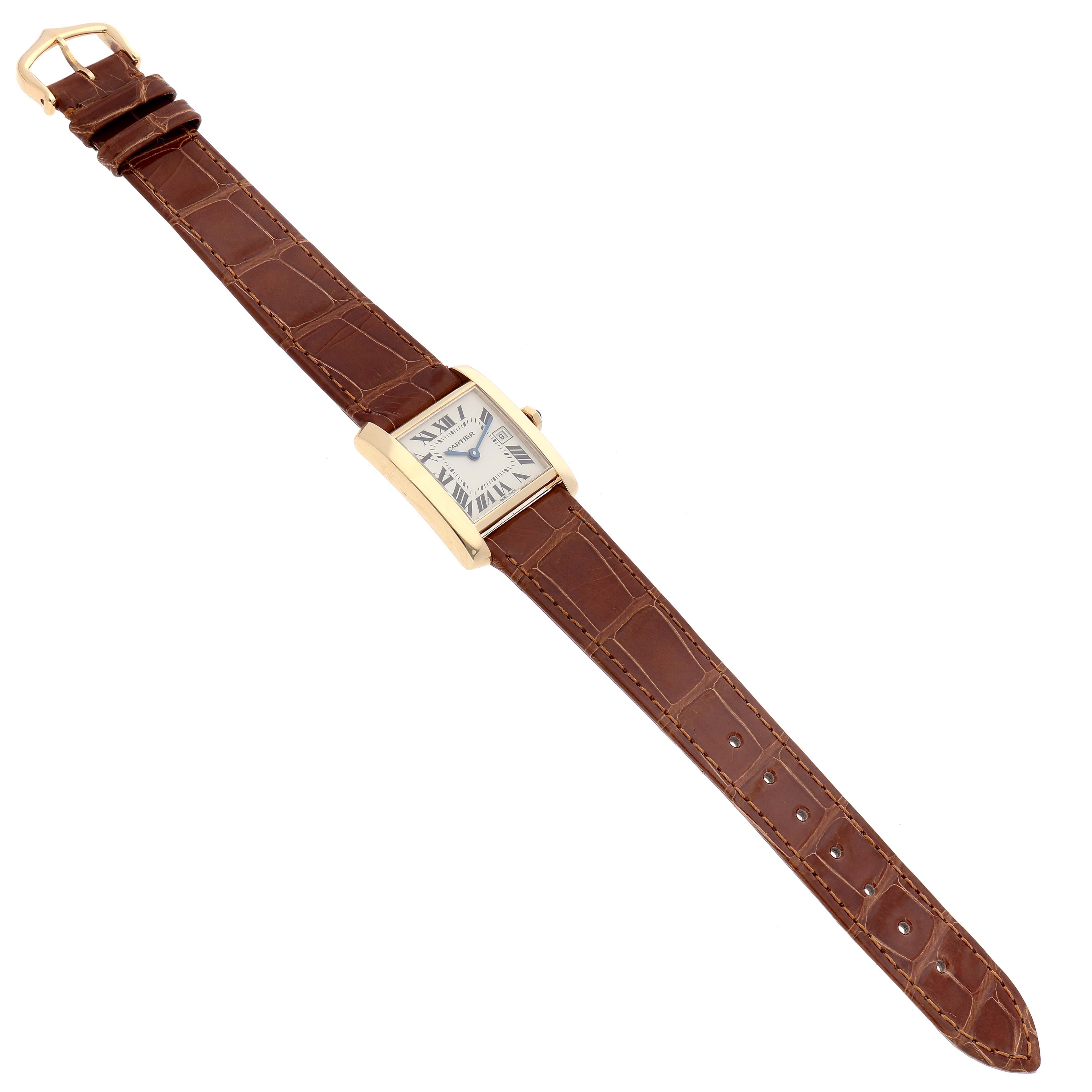 The image shows a Cartier Tank Francaise W5001456 Women's Yellow Gold Silver Dial W5001456 Women's Yellow Gold Silver Dial watch with a brown leather strap, viewed from a top-down angle.