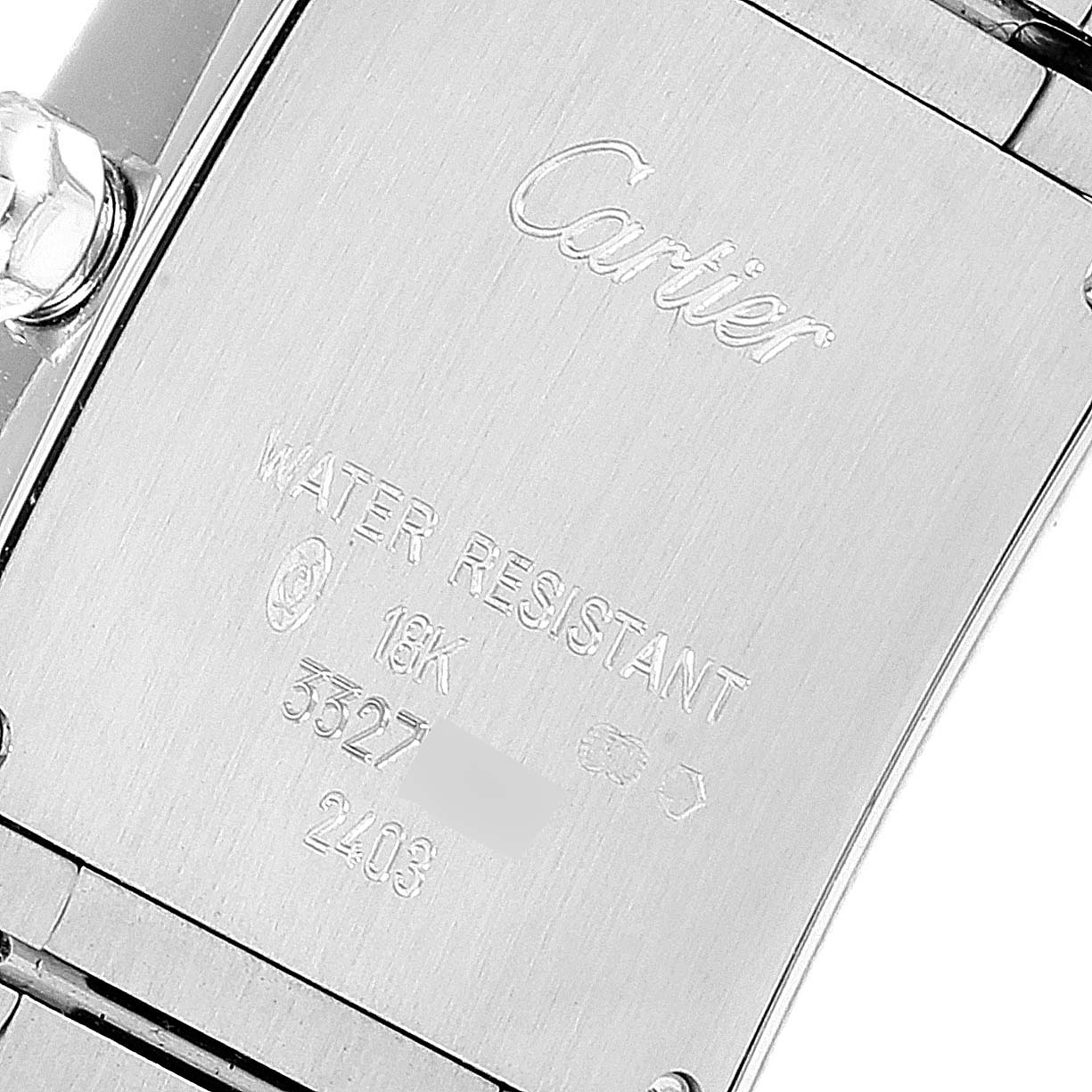 This image shows the back case of a Cartier Tank Francaise 2403 Women's White Gold Blue Dial 2403 Women's White Gold Blue Dial watch, displaying its inscriptions and metal details.