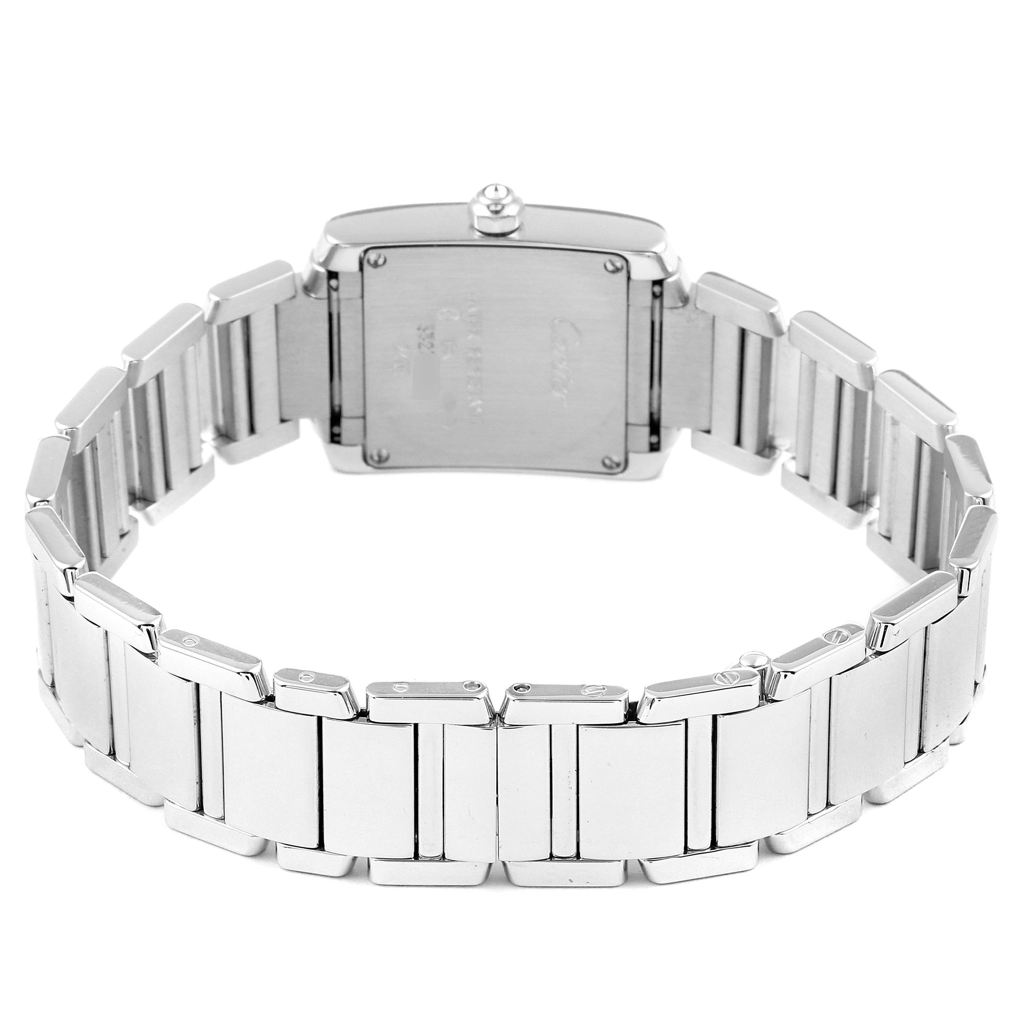 The image shows the back case and bracelet of a Cartier Tank Française watch from a rear angle.