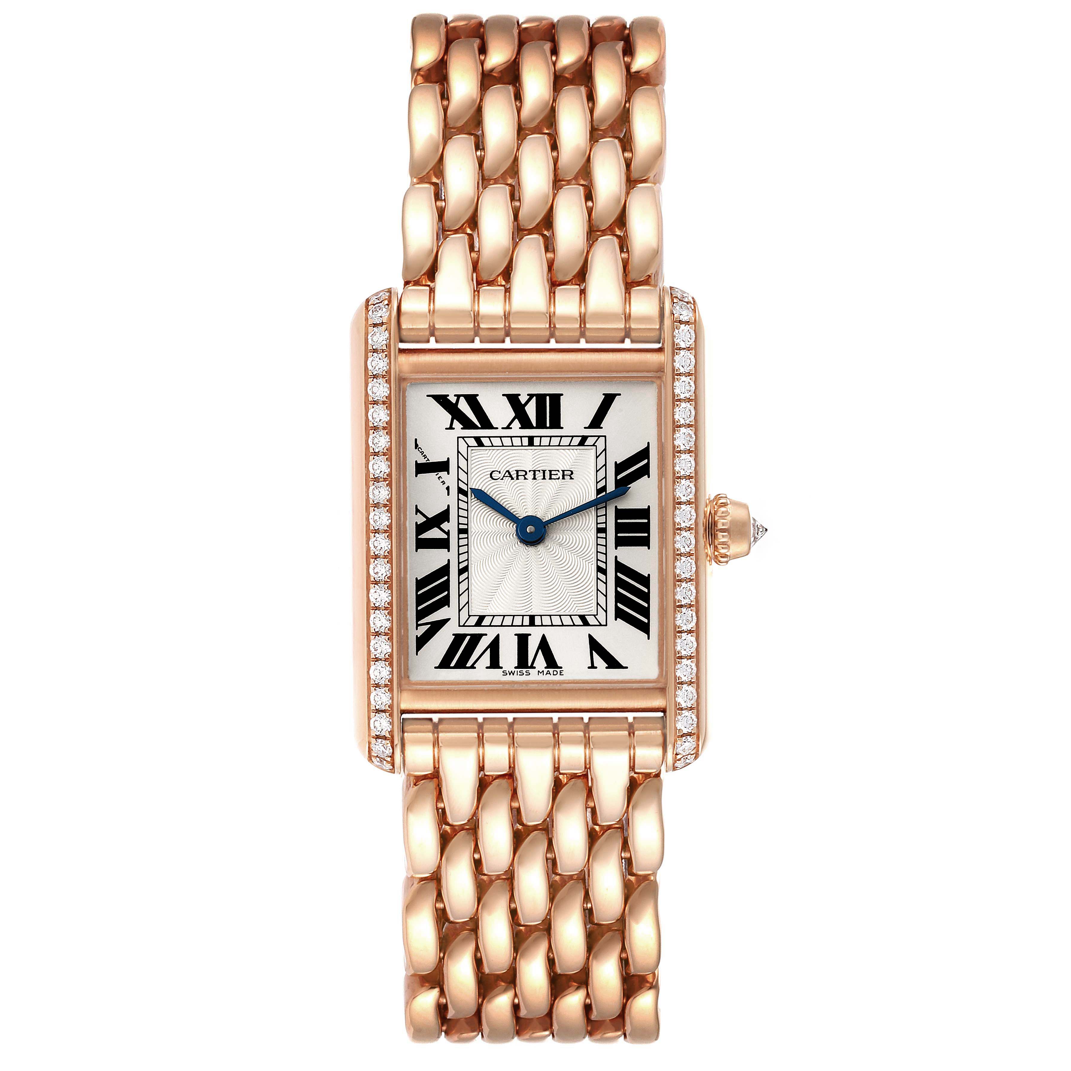 The Tank Louis model by Cartier is shown from a top-down angle, displaying the rectangular face, Roman numeral dial, and gold bracelet.