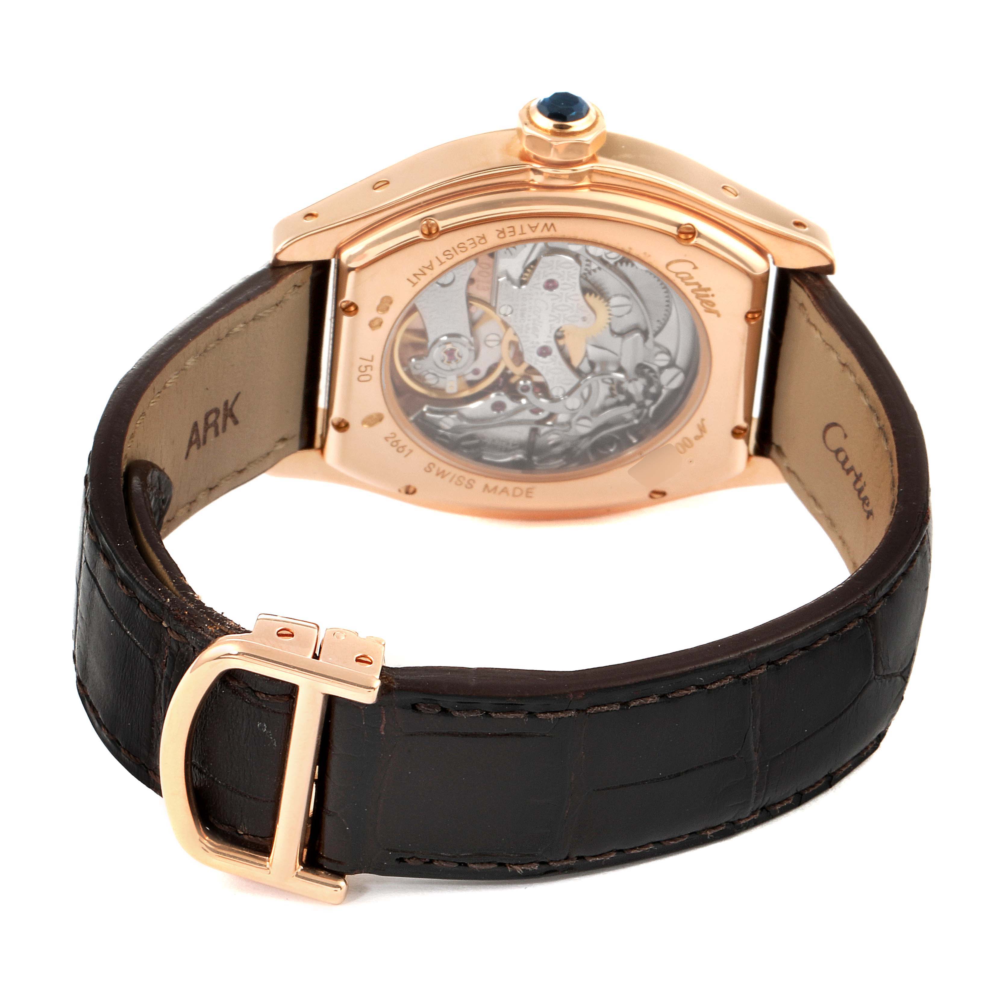 The image shows the back view of a Cartier Tortue W1543651 Men's Rose Gold Silver Dial W1543651 Men's Rose Gold Silver Dial watch, displaying its mechanical inner workings and leather strap with buckle.