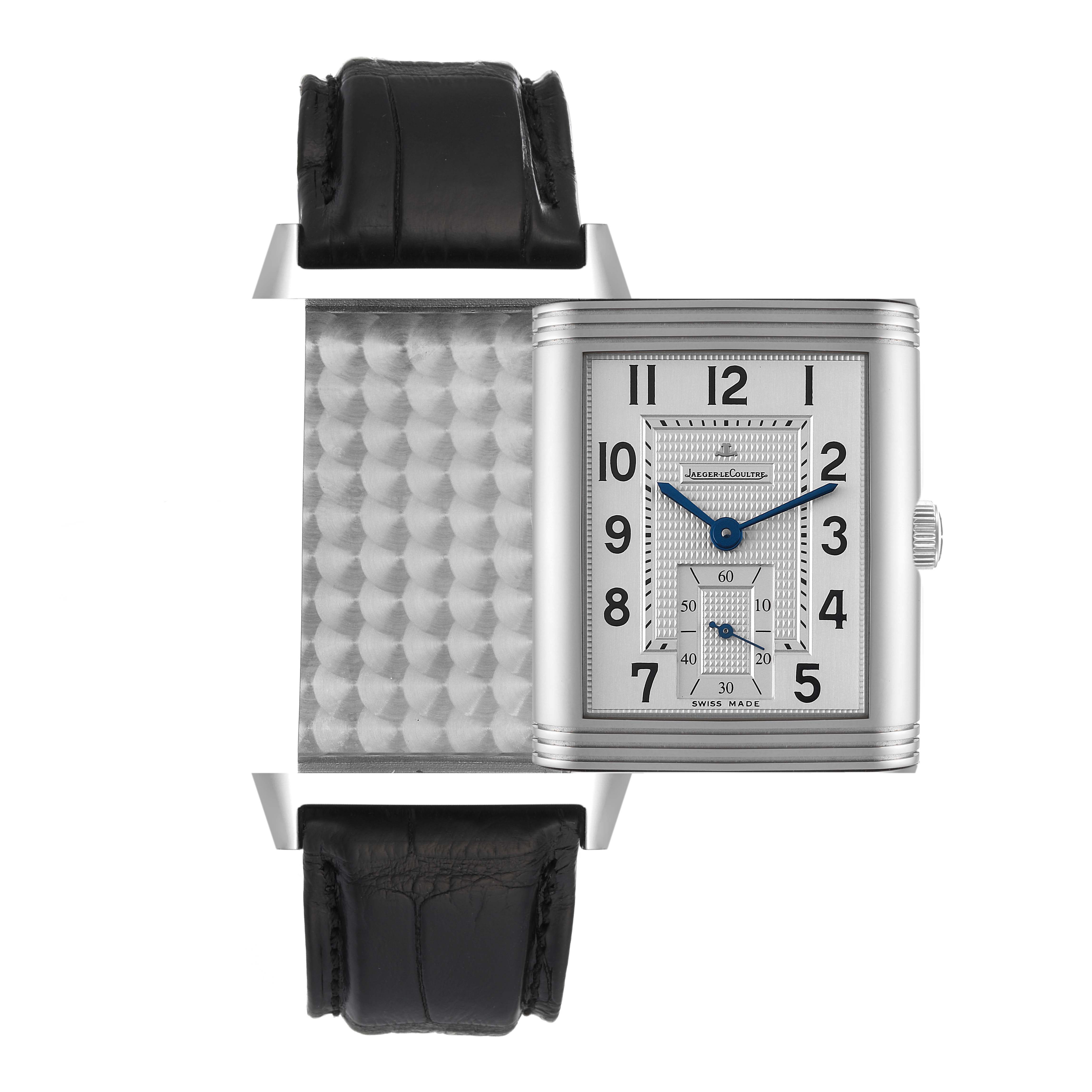 The image shows a Jaeger LeCoultre Reverso Q3738420 Men
s Stainless Steel Silver Dial Q3738420 Men
s Stainless Steel Silver Dial watch at an angle highlighting the front dial and the reverse textured metal side.