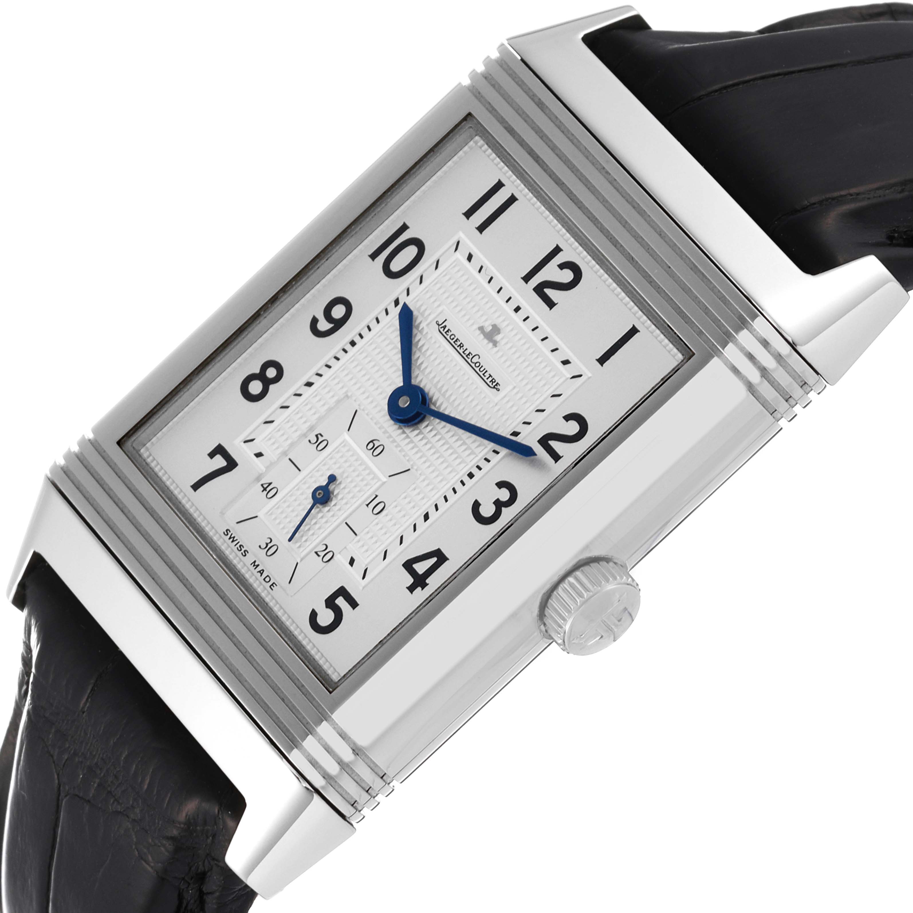 The image shows a Jaeger LeCoultre Reverso Q3738420 Men
s Stainless Steel Silver Dial Q3738420 Men
s Stainless Steel Silver Dial watch at an angled view, highlighting its rectangular face, crown, and part of the black strap.