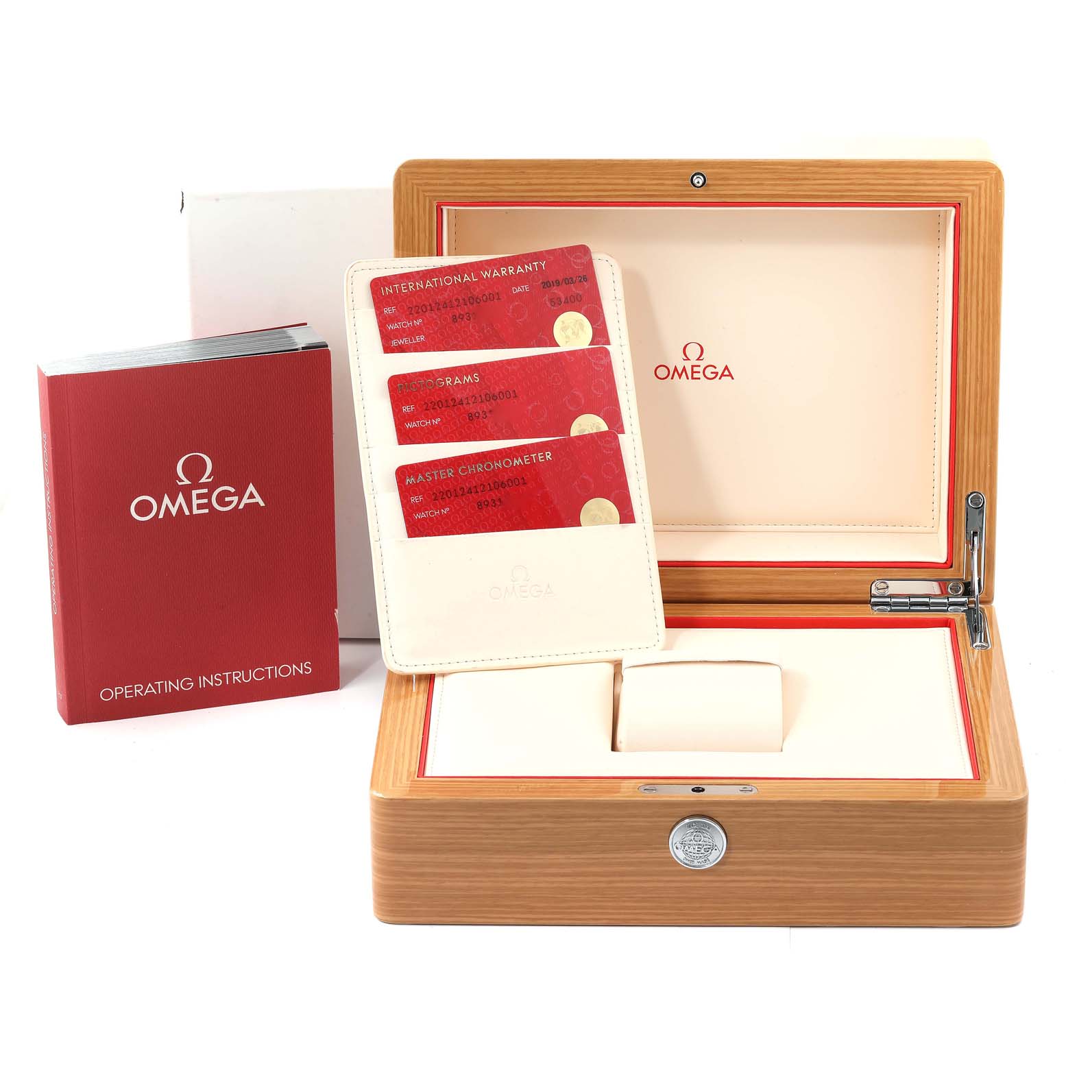 The image shows the accessories of the Omega Aqua Terra 220.12.41.21.06.001 Men
s Stainless Steel Grey Dial 220.12.41.21.06.001 Men
s Stainless Steel Grey Dial watch, including its wooden box, warranty cards, and operating instructions booklet.