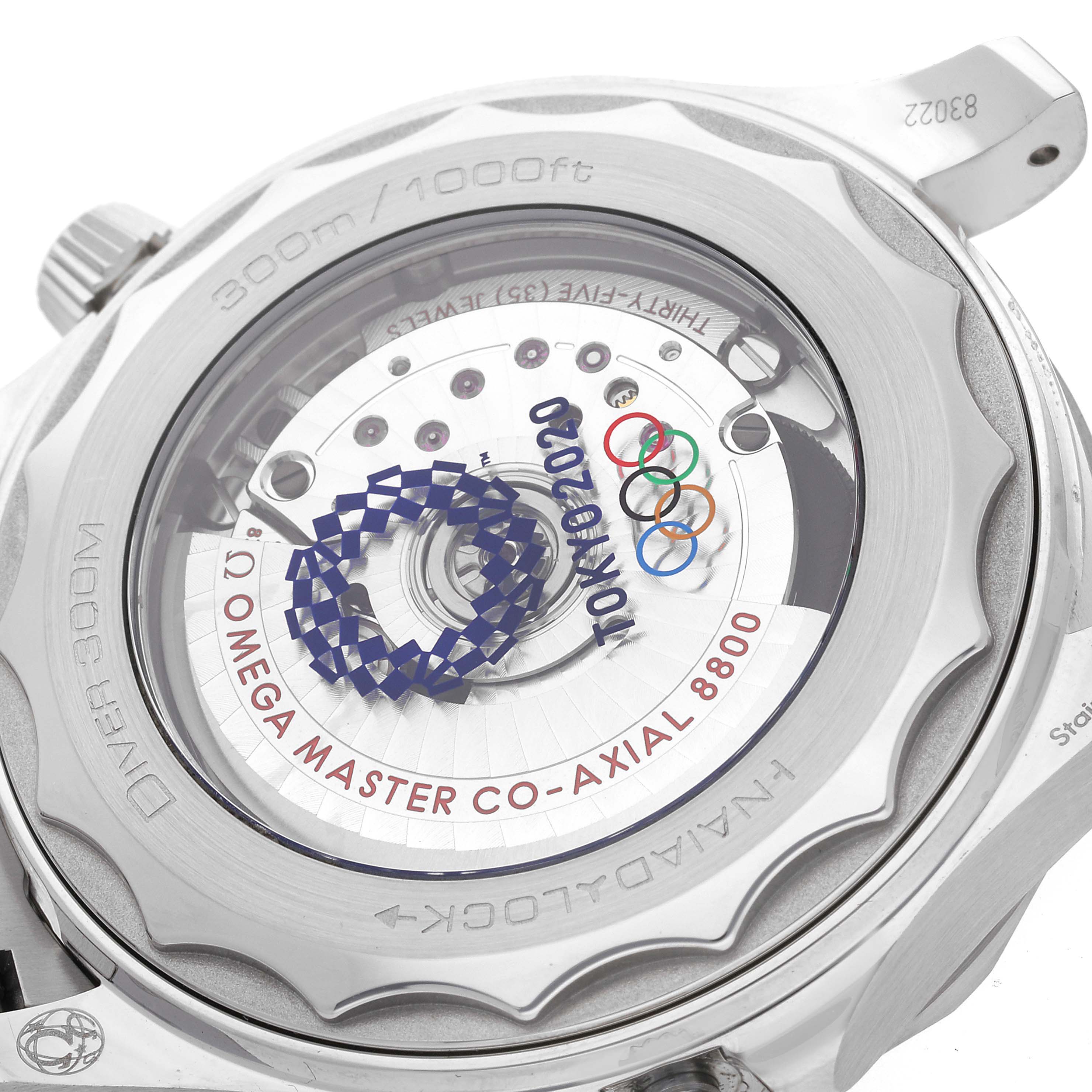 This image shows the back of the Omega Seamaster 522.30.42.20.04.001 Men
s Stainless Steel White Dial 522.30.42.20.04.001 Men
s Stainless Steel White Dial watch, highlighting its Tokyo 2020 Olympic-themed co-axial movement and transparent case back.