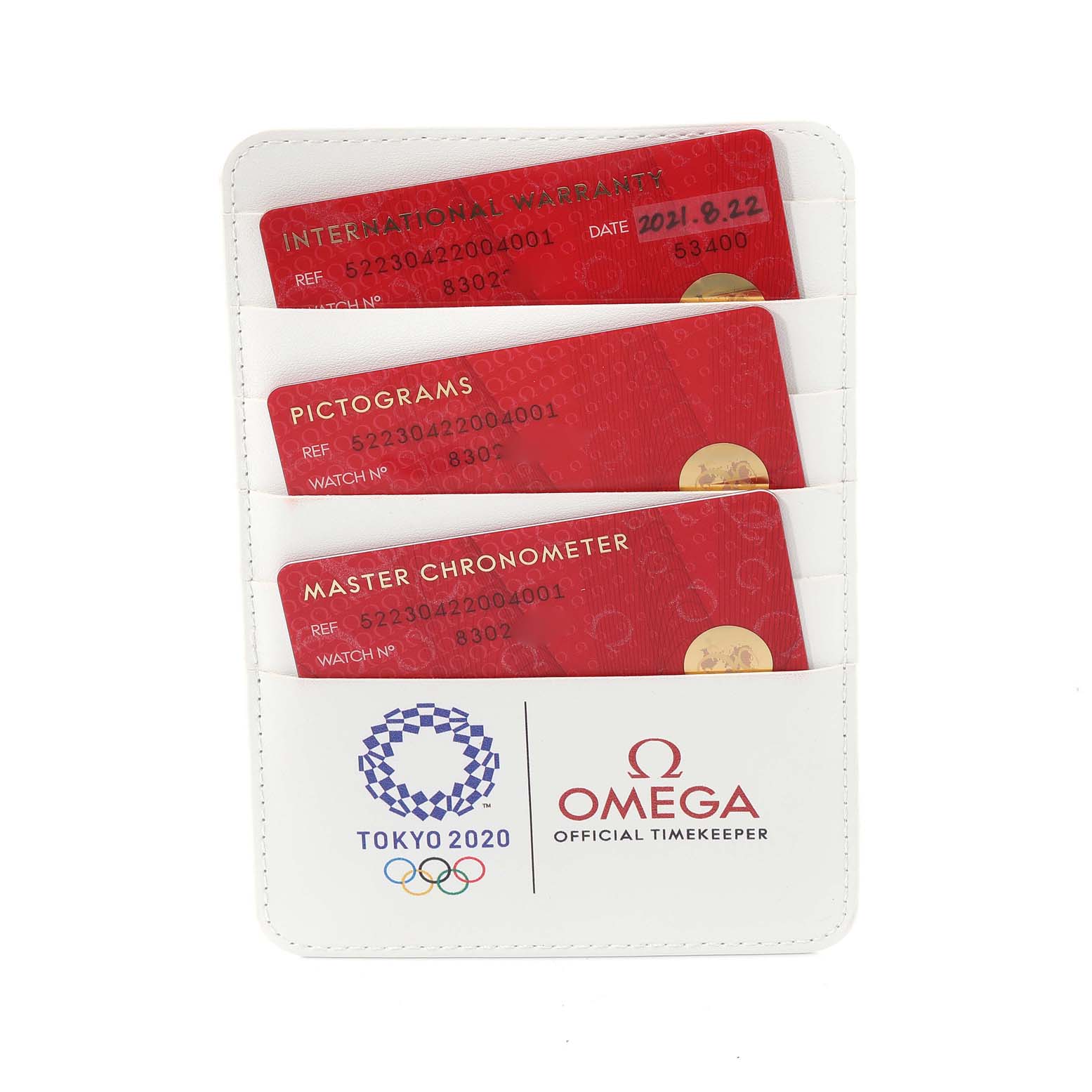 The image shows warranty cards for an Omega Seamaster 522.30.42.20.04.001 Men
s Stainless Steel White Dial 522.30.42.20.04.001 Men
s Stainless Steel White Dial watch, displayed in a white cardholder with Tokyo 2020 branding.