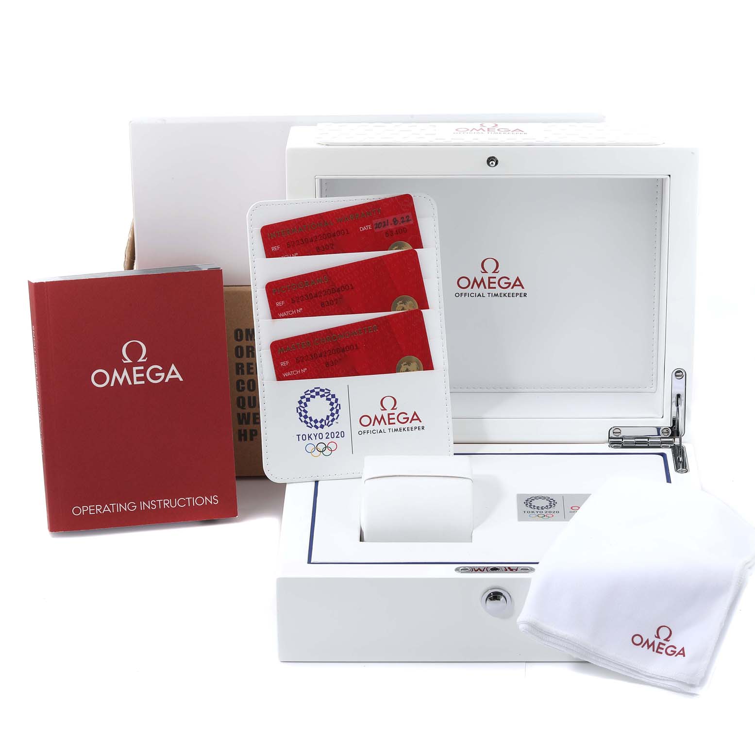 The image shows the packaging and accessories for an Omega Seamaster 522.30.42.20.04.001 Men
s Stainless Steel White Dial 522.30.42.20.04.001 Men
s Stainless Steel White Dial, including a box, operating instructions, cards, and a cloth.