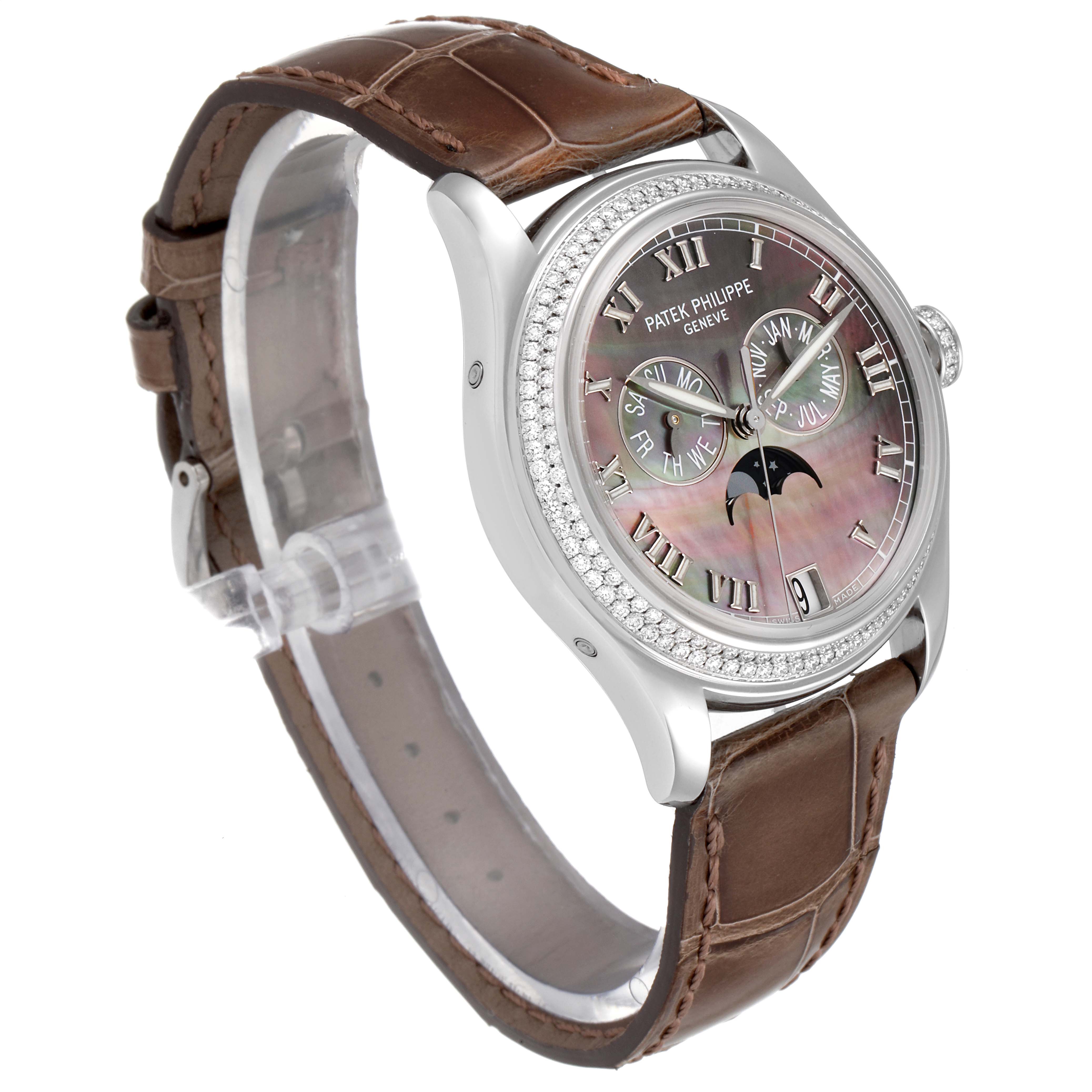 The image shows a side angle of a Patek Philippe Complications 4936G - 001 Men's White Gold Mother of Pearl Dial 4936G - 001 Men's White Gold Mother of Pearl Dial watch, featuring a brown leather strap and a detailed dial.