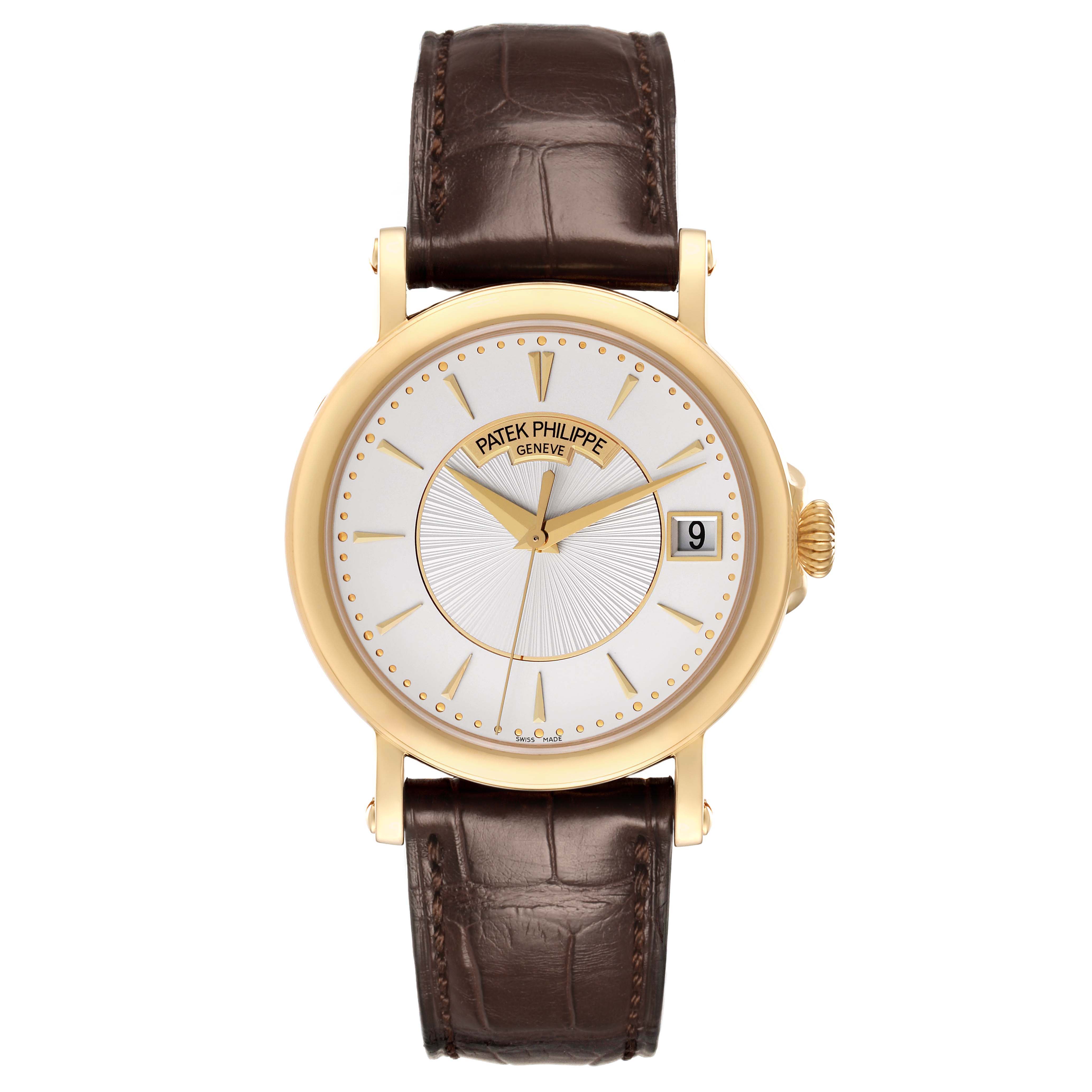 The Patek Philippe Calatrava 5153J-001 Men's Yellow Gold Silver Dial watch is shown from a top-down angle, displaying the face, gold case, and brown leather strap.