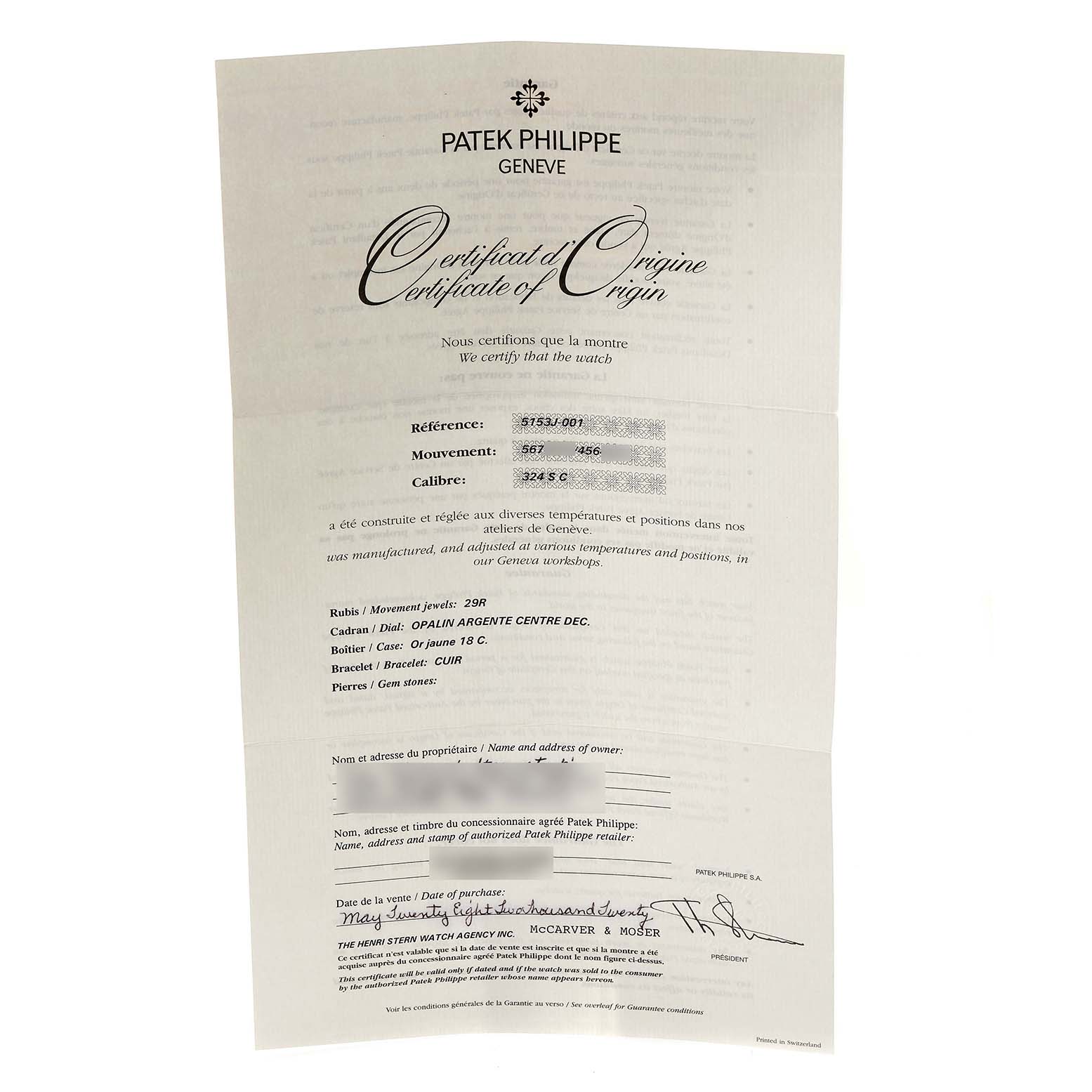 The image shows a close-up of the Certificate of Origin for a Patek Philippe Calatrava 5153J-001 Men's Yellow Gold Silver Dial 5153J-001 Men's Yellow Gold Silver Dial model watch.
