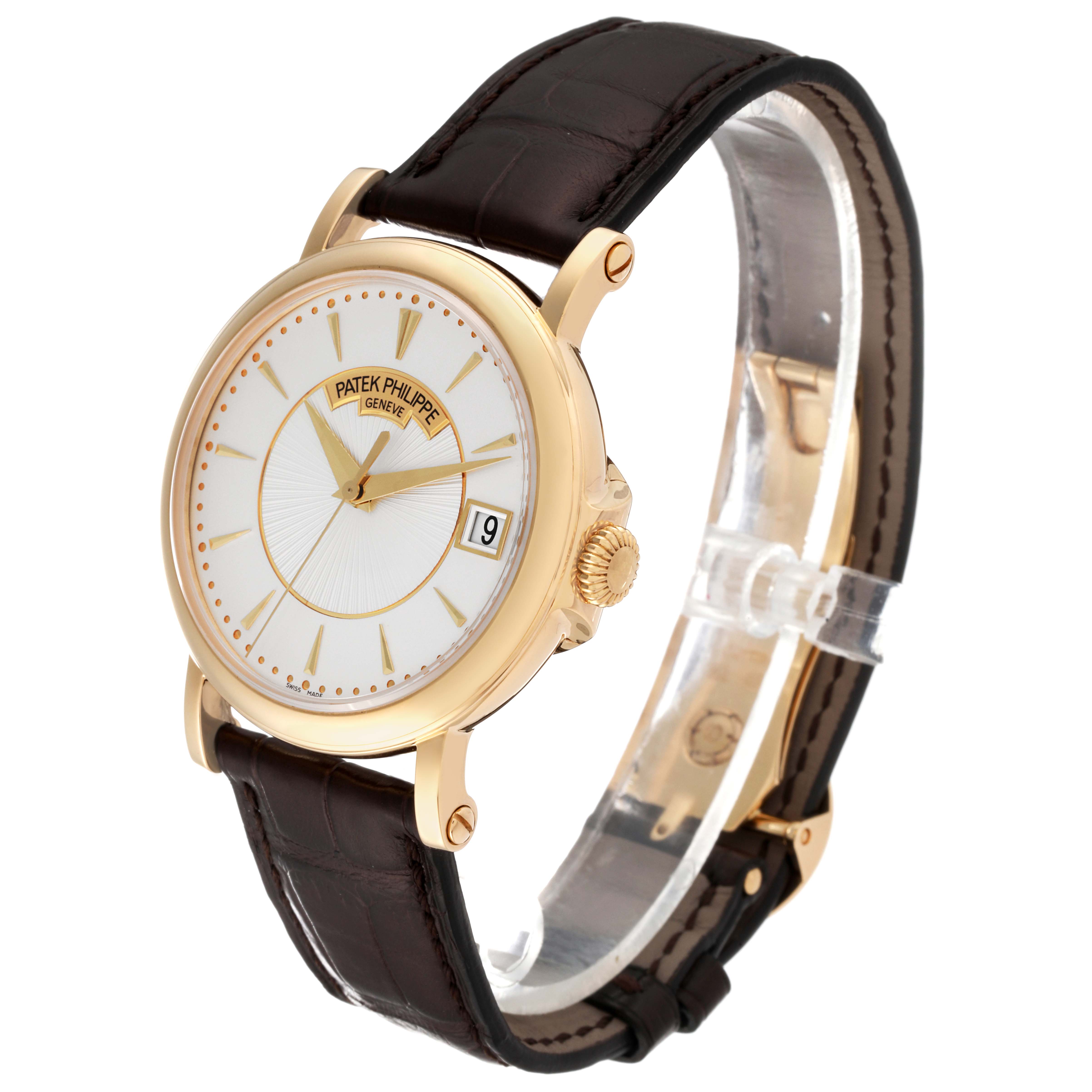 The image shows a Patek Philippe Calatrava 5153J-001 Men's Yellow Gold Silver Dial 5153J-001 Men's Yellow Gold Silver Dial watch at a three-quarter angle, highlighting its face, crown, and leather strap.