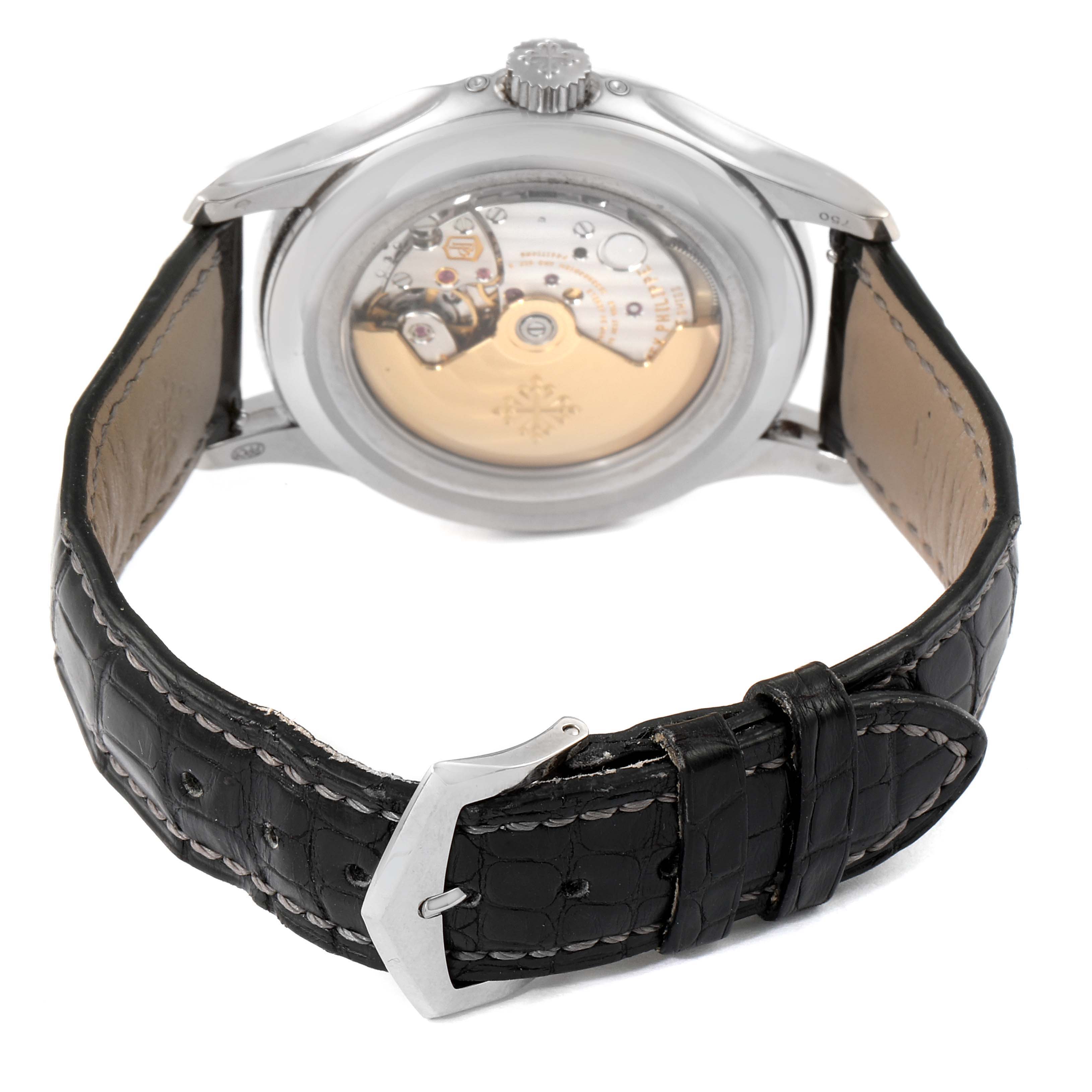 The image shows the back view of a Patek Philippe Complications 5205G - 010 Men's White Gold Grey Dial 5205G - 010 Men's White Gold Grey Dial model watch, highlighting the movement and black leather strap.