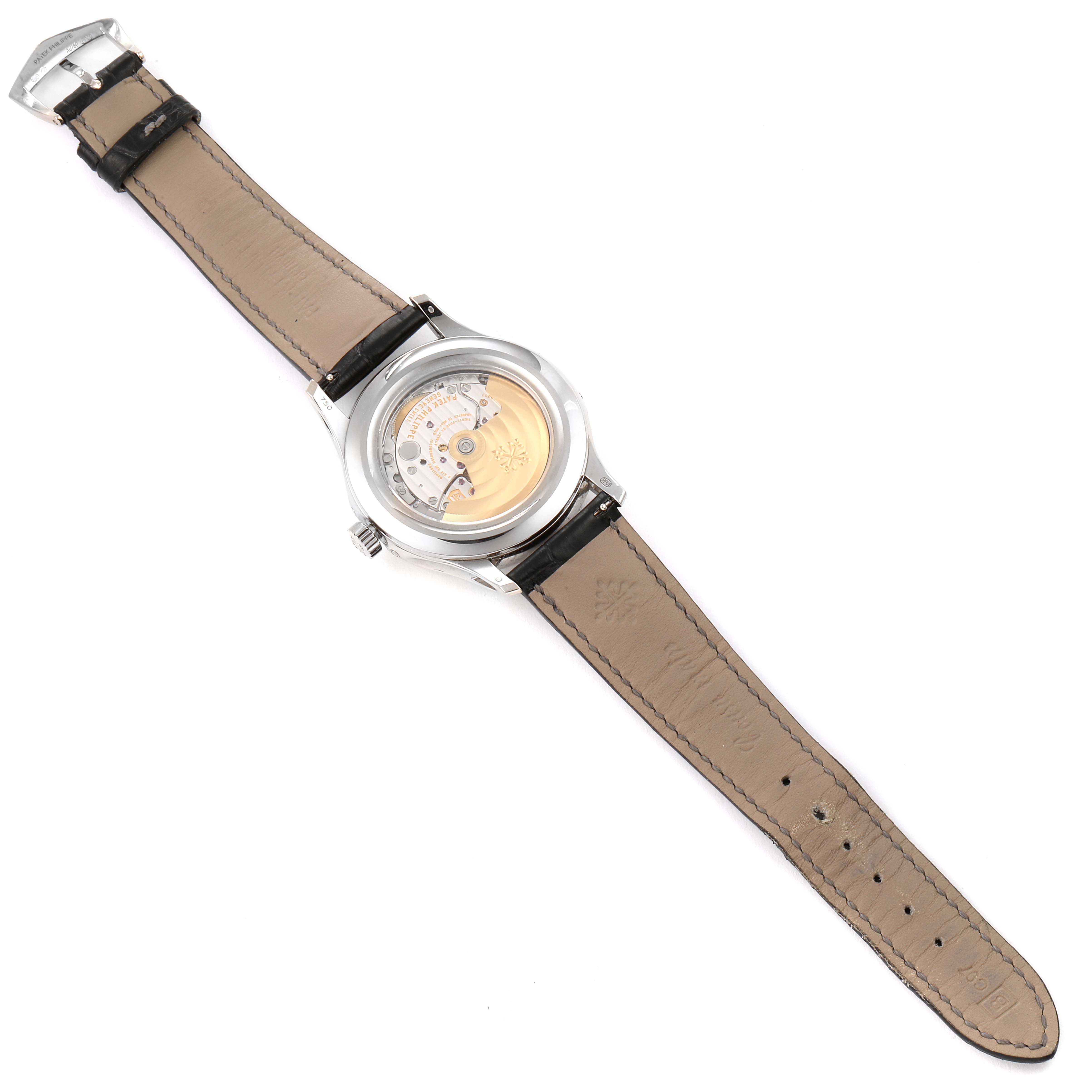 This image shows the back view of a Patek Philippe Complications 5205G - 010 Men's White Gold Grey Dial 5205G - 010 Men's White Gold Grey Dial model watch, highlighting its movement mechanism and leather strap.