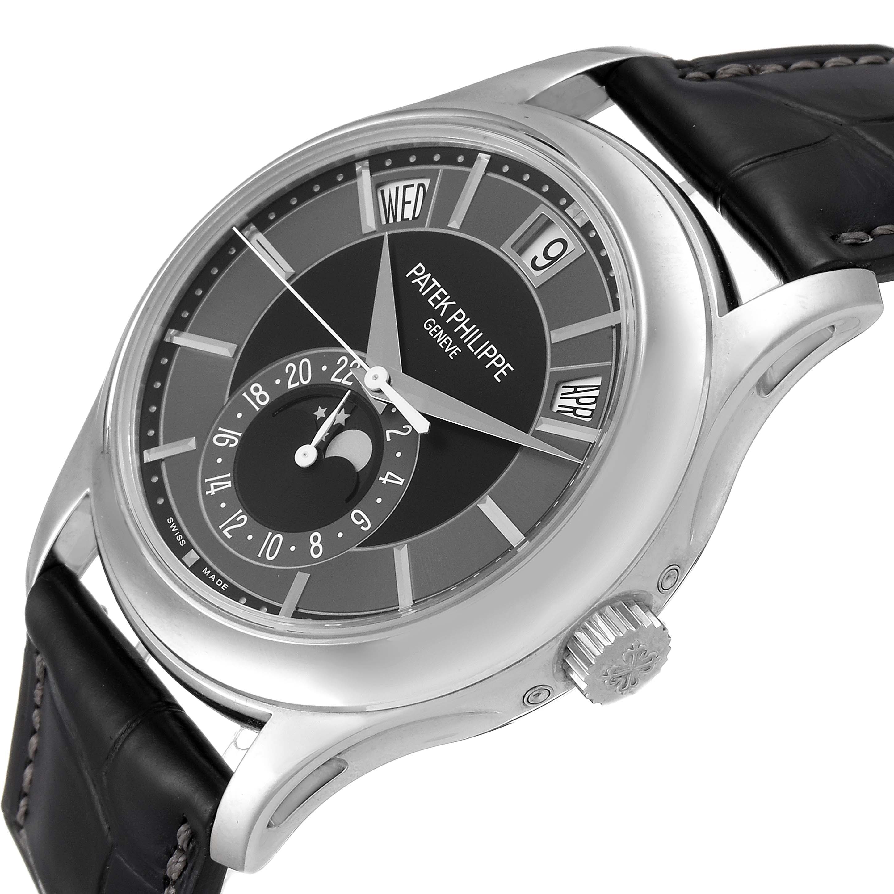 The image shows a side angle view of a Patek Philippe Complications 5205G - 010 Men's White Gold Grey Dial 5205G - 010 Men's White Gold Grey Dial watch featuring its dial, case, crown, and part of the strap.