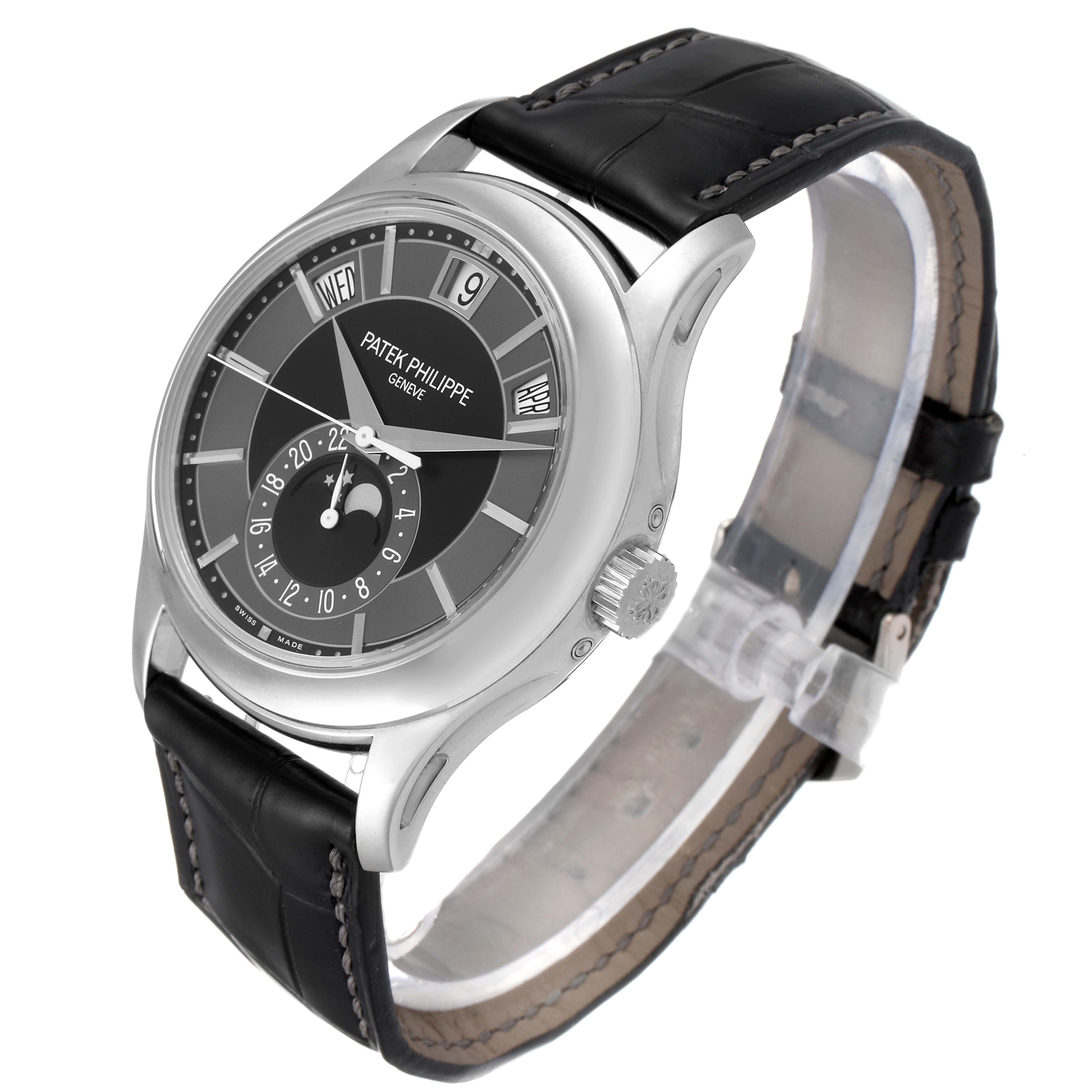 The Patek Philippe Complications 5205G - 010 Men's White Gold Grey Dial 5205G - 010 Men's White Gold Grey Dial model watch is shown at an angled side view displaying its dial, case, and leather strap.