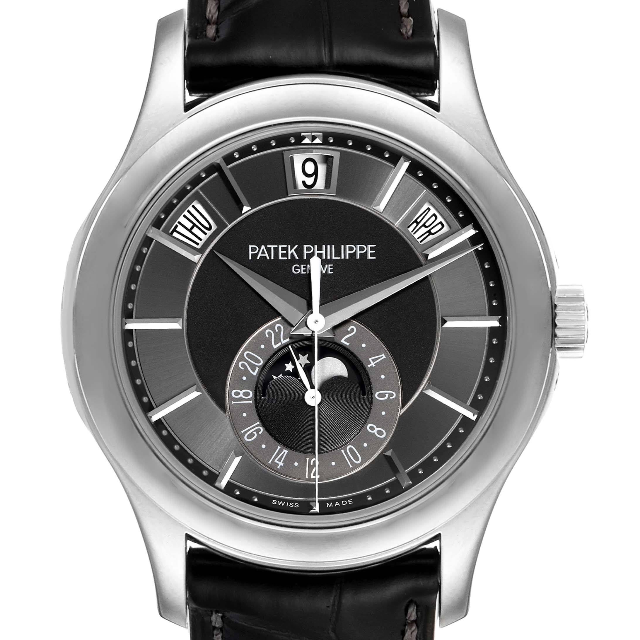 The image shows a front view of the Patek Philippe Complications 5205G - 010 Men's White Gold Grey Dial 5205G - 010 Men's White Gold Grey Dial watch, displaying its dial, day, date, month, and moon phase features.